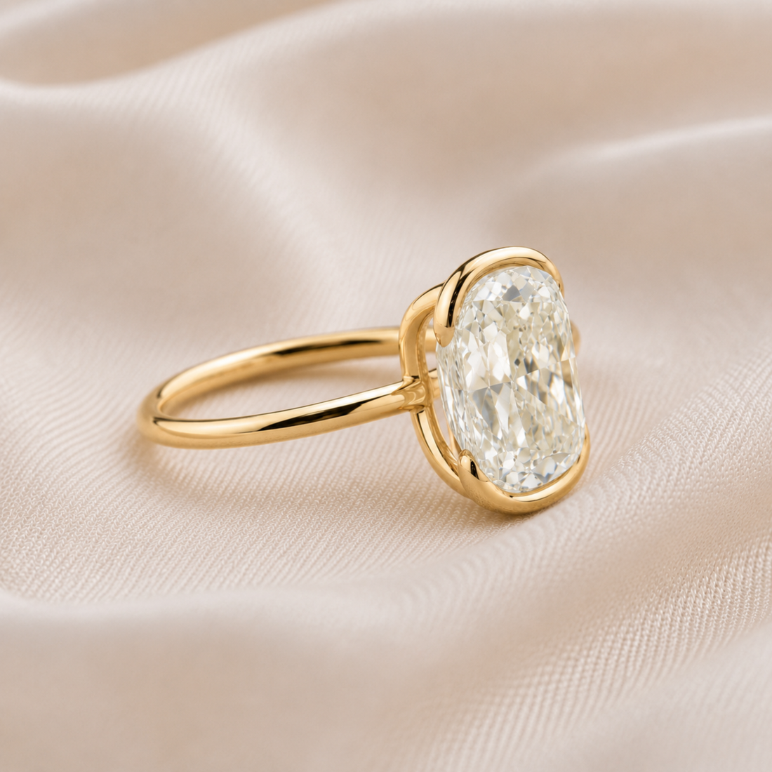 Large oval diamond engagement ring with minimalist yellow gold band