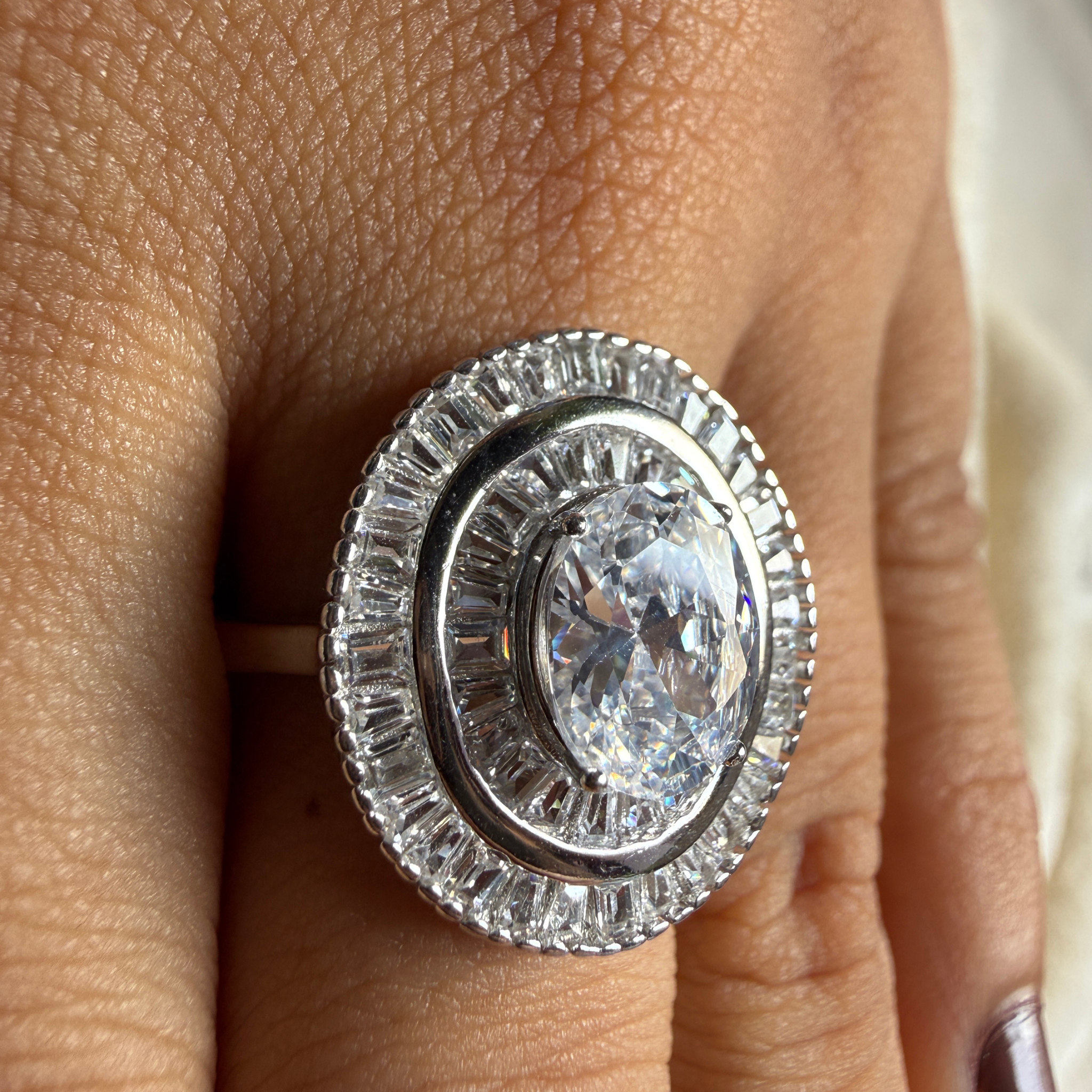 Oval and baguette lab-grown diamond double halo ring by Kiashaa Jewellery.