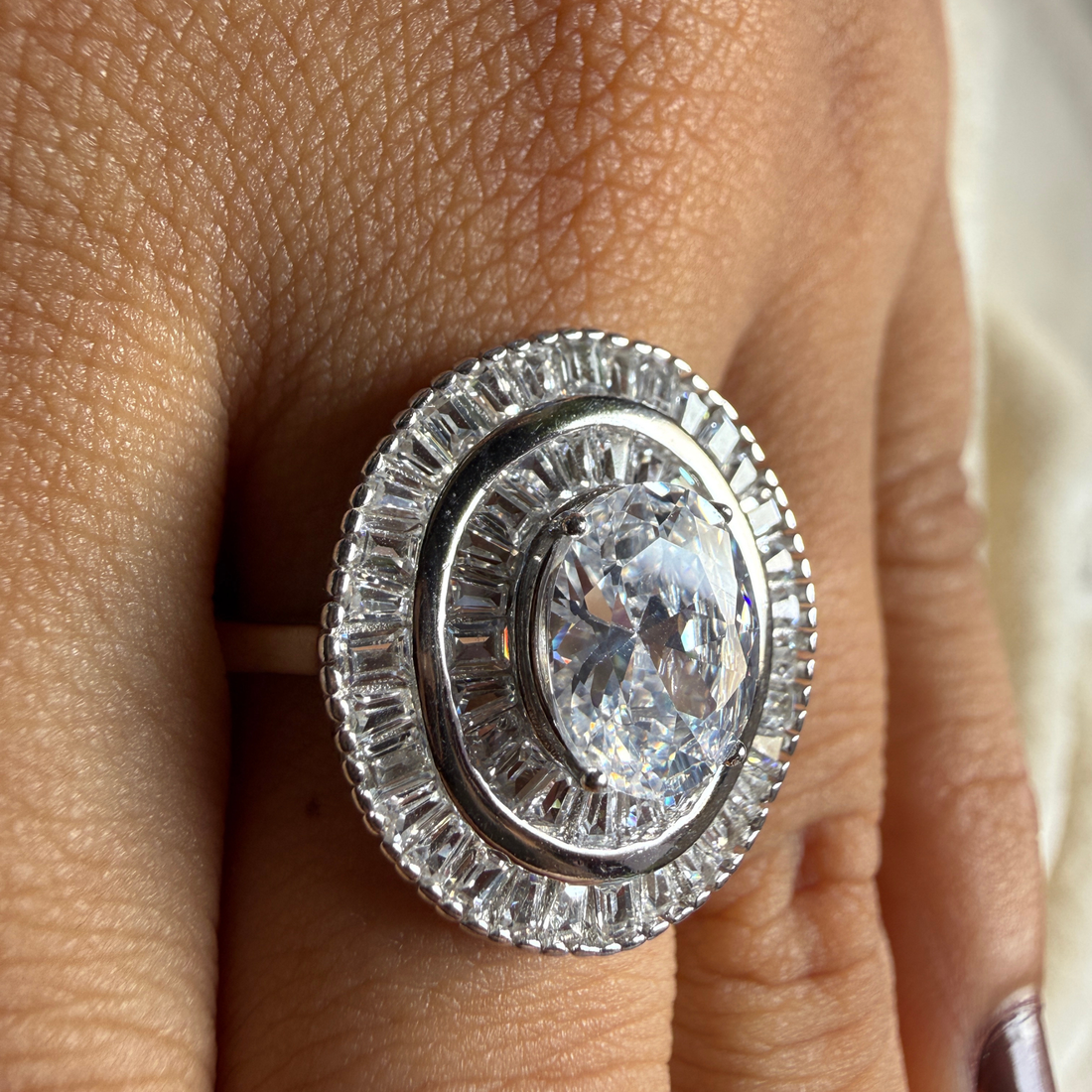 Oval and baguette lab-grown diamond double halo ring by Kiashaa Jewellery.