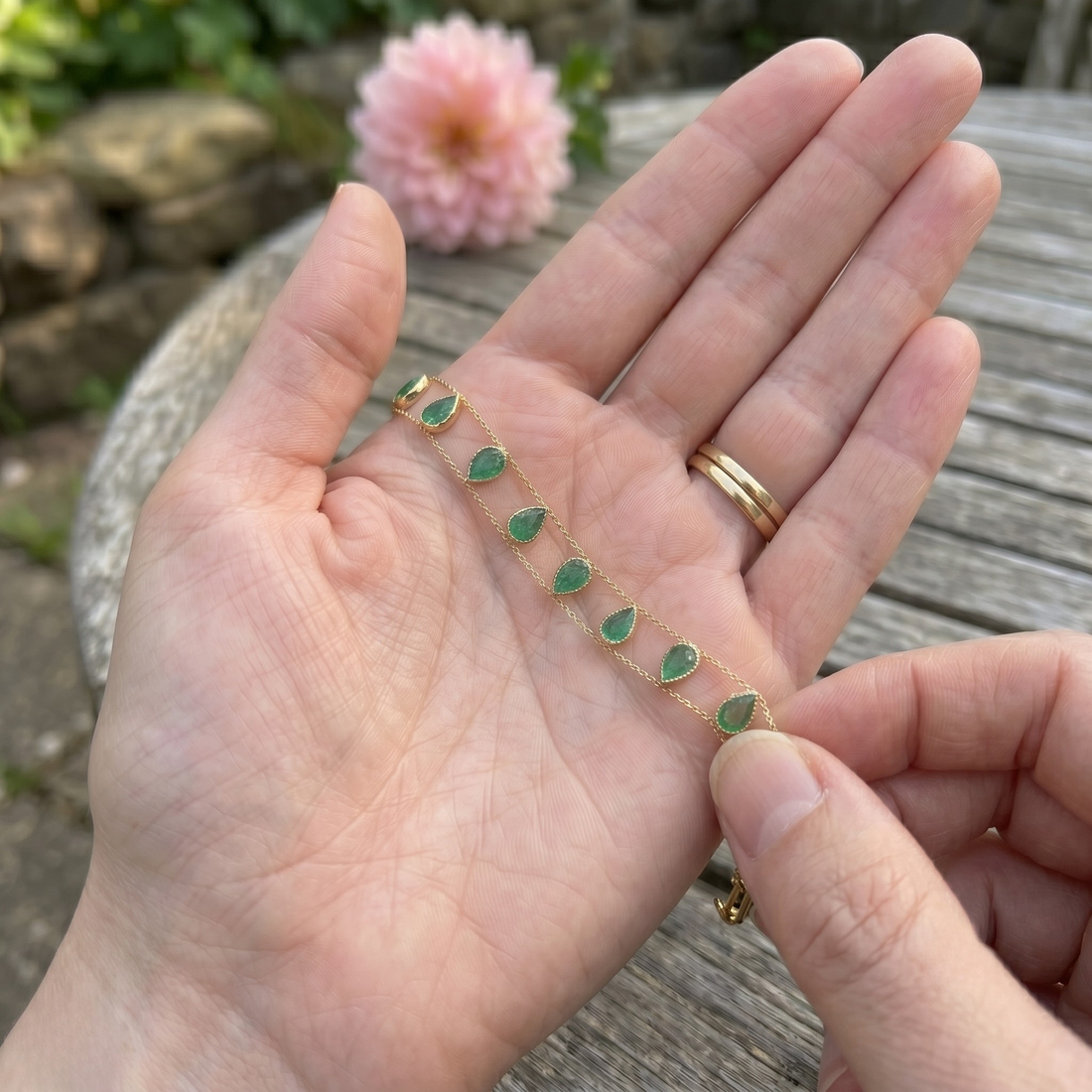 Elegant botanical bracelet with pear and marquise-shaped green crystal stations.