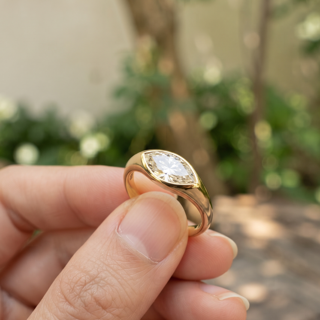Kiashaa Jewellery 1.76 CT marquise bezel diamond ring in polished yellow gold.