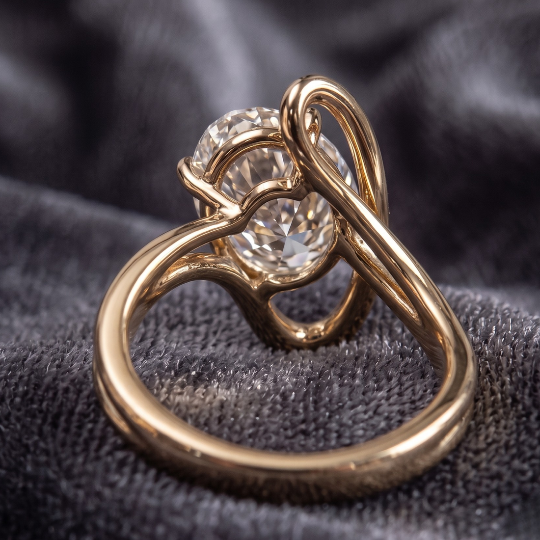 Statement oval diamond ring with open orbit-inspired gold setting