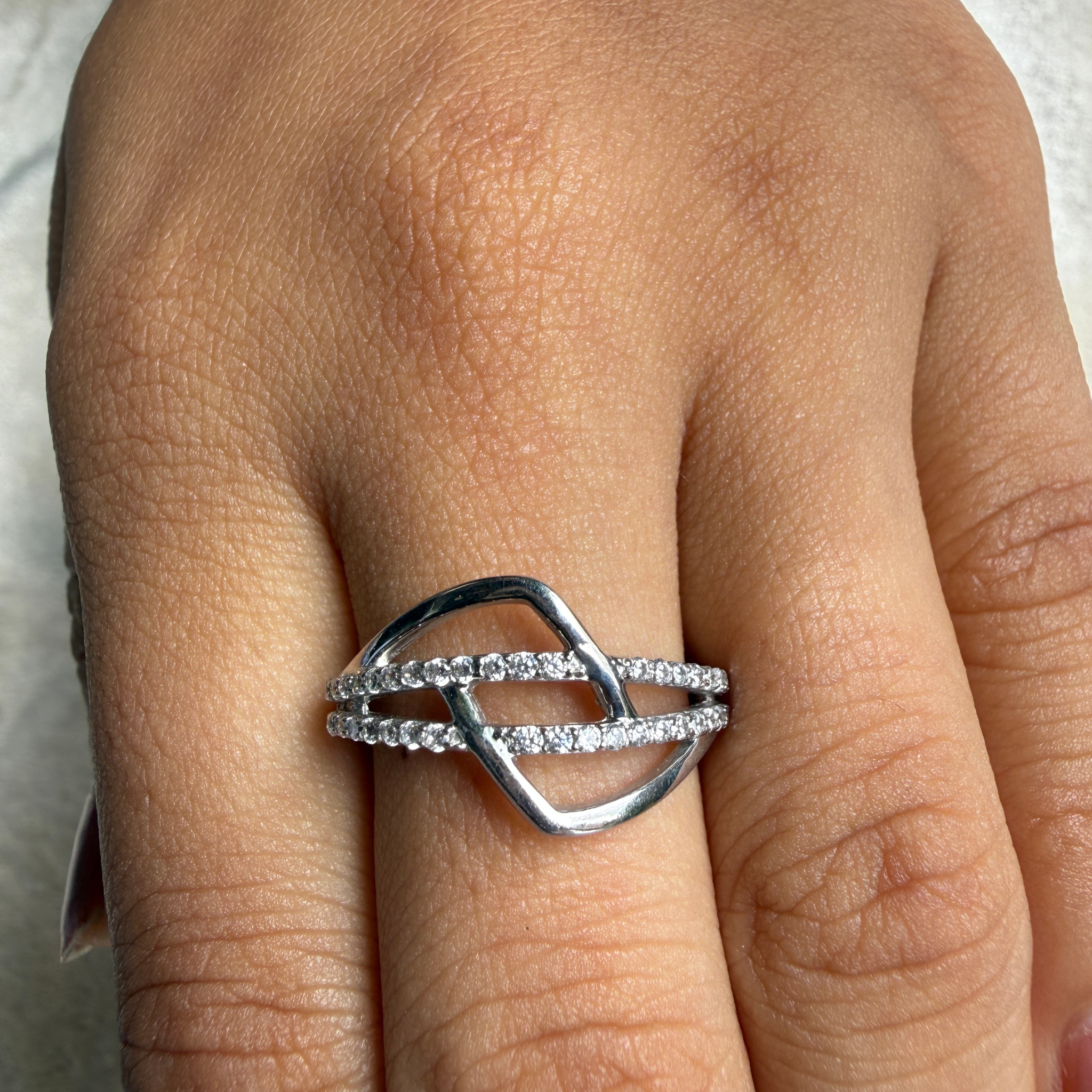 Contemporary open-frame diamond ring handcrafted in 9K, 14K and 18K gold.