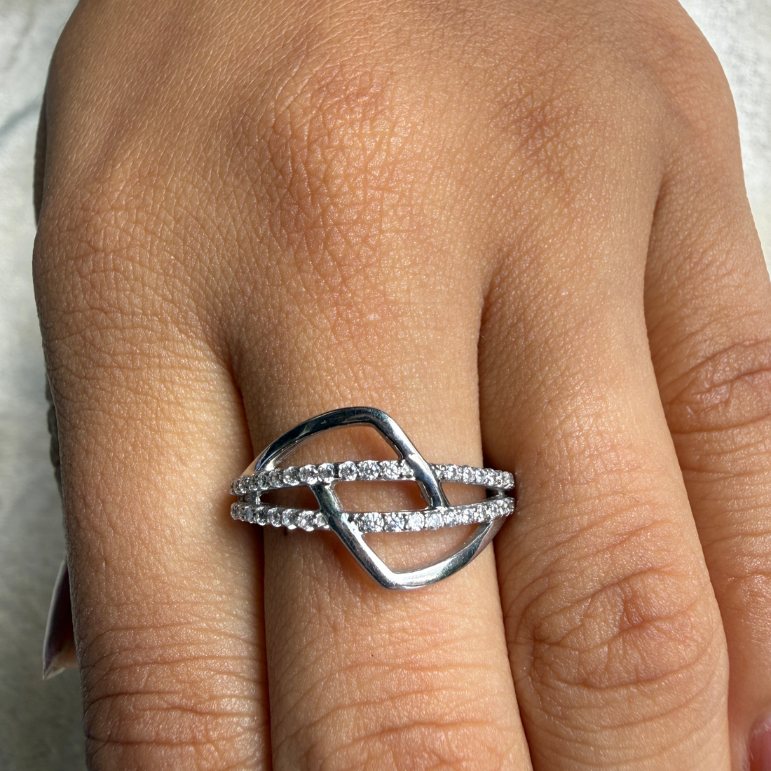 Contemporary open-frame diamond ring handcrafted in 9K, 14K and 18K gold.