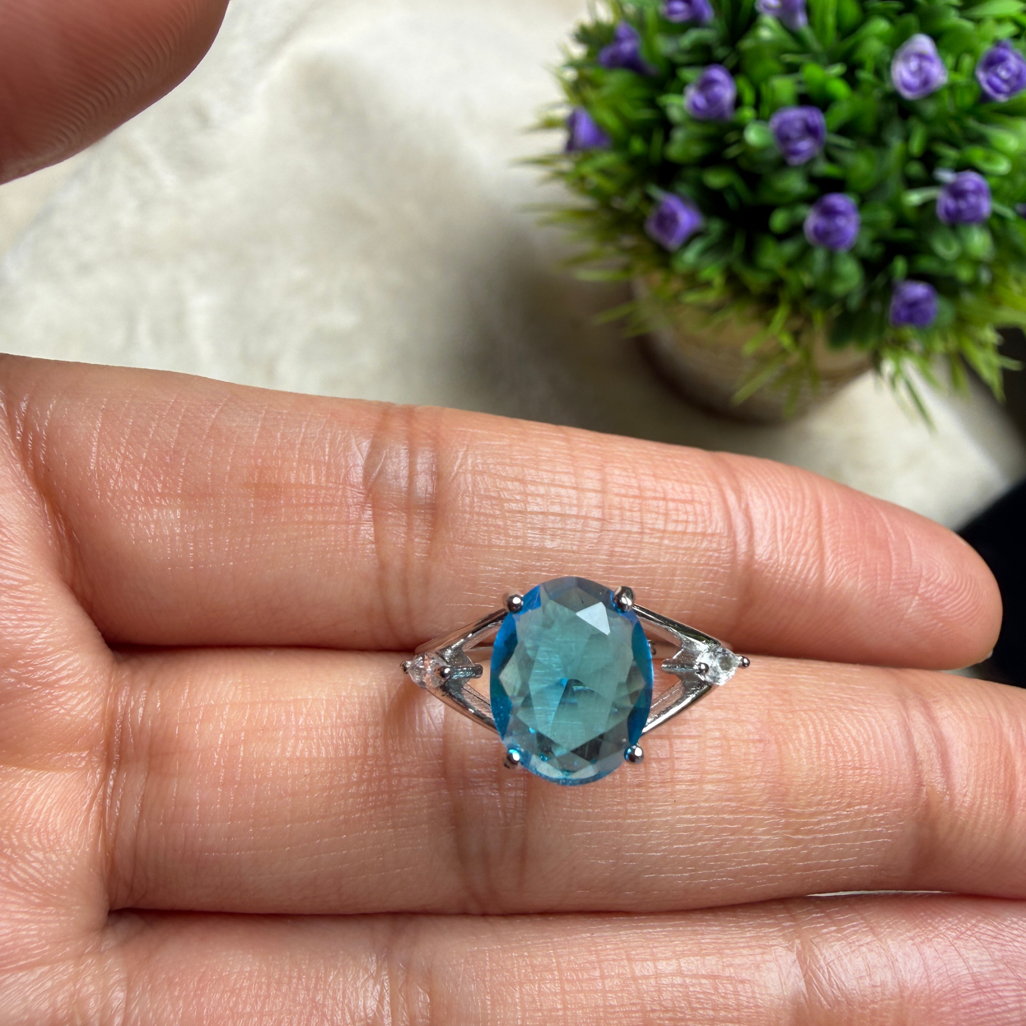 Blue oval gemstone solitaire ring with marquise lab-grown diamonds by Kiashaa Jewellery.