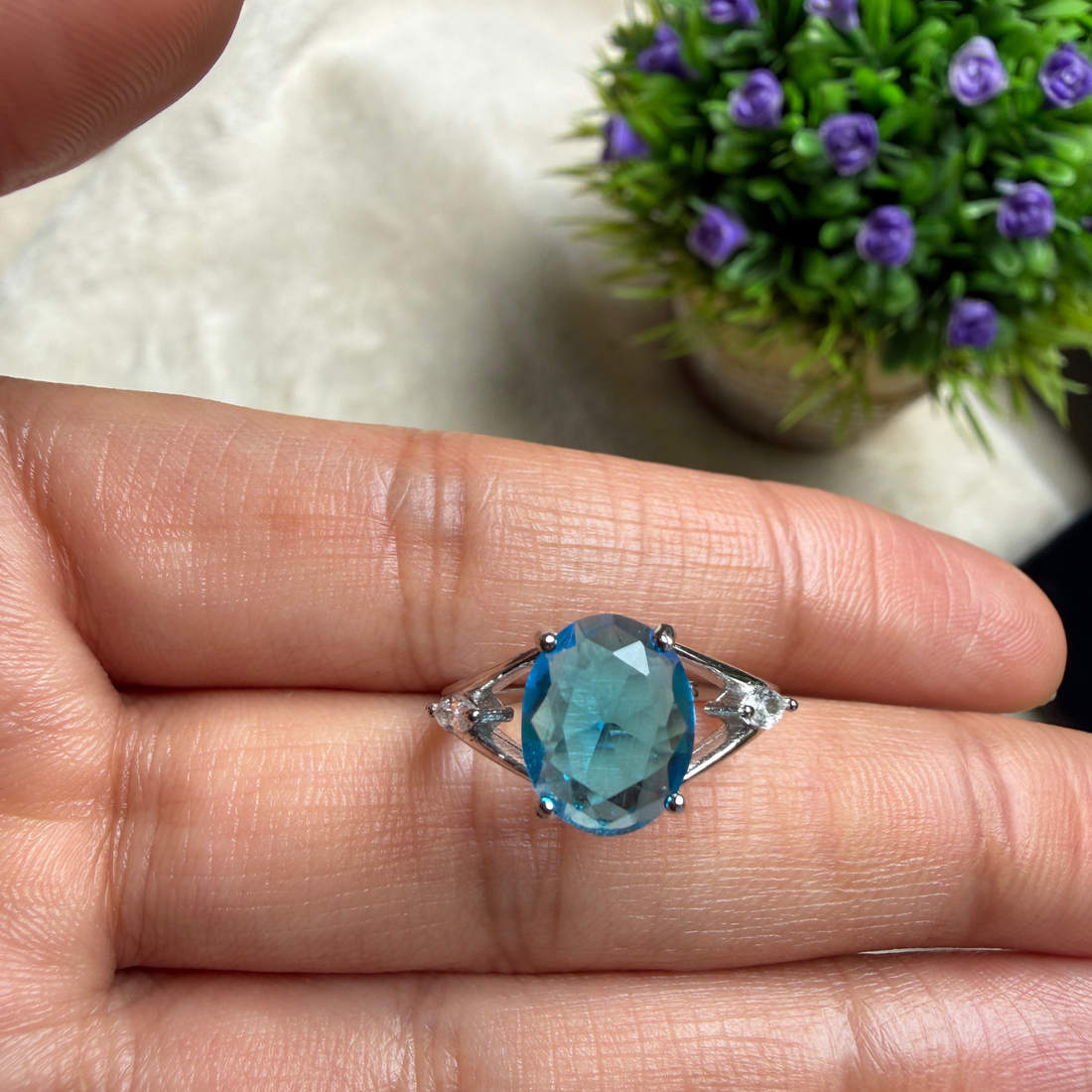 Blue oval gemstone solitaire ring with marquise lab-grown diamonds by Kiashaa Jewellery.