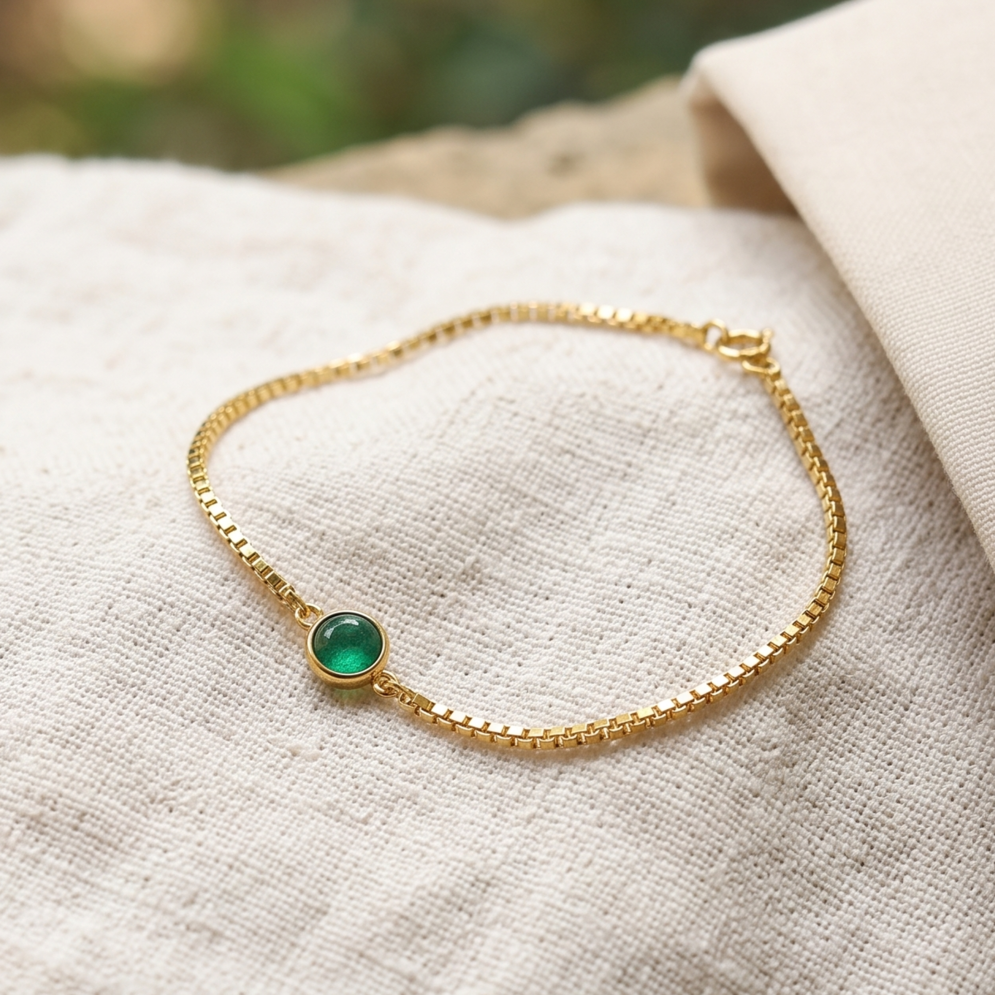 Kiashaa Jewellery 0.50 CT green oval gemstone bracelet in polished yellow gold.