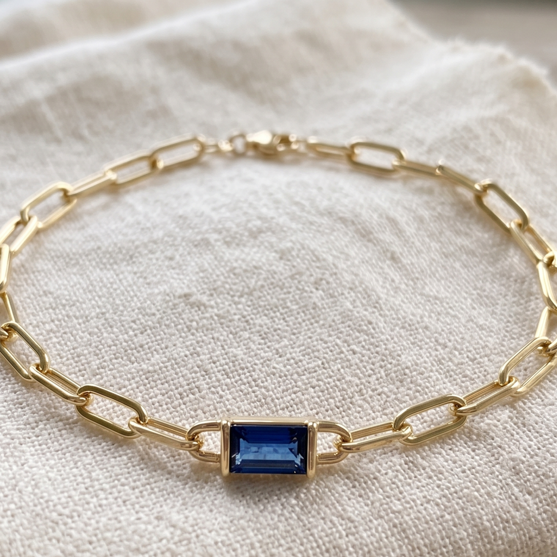 Kiashaa Jewellery 2.58 CT blue emerald-cut link bracelet in polished yellow gold.