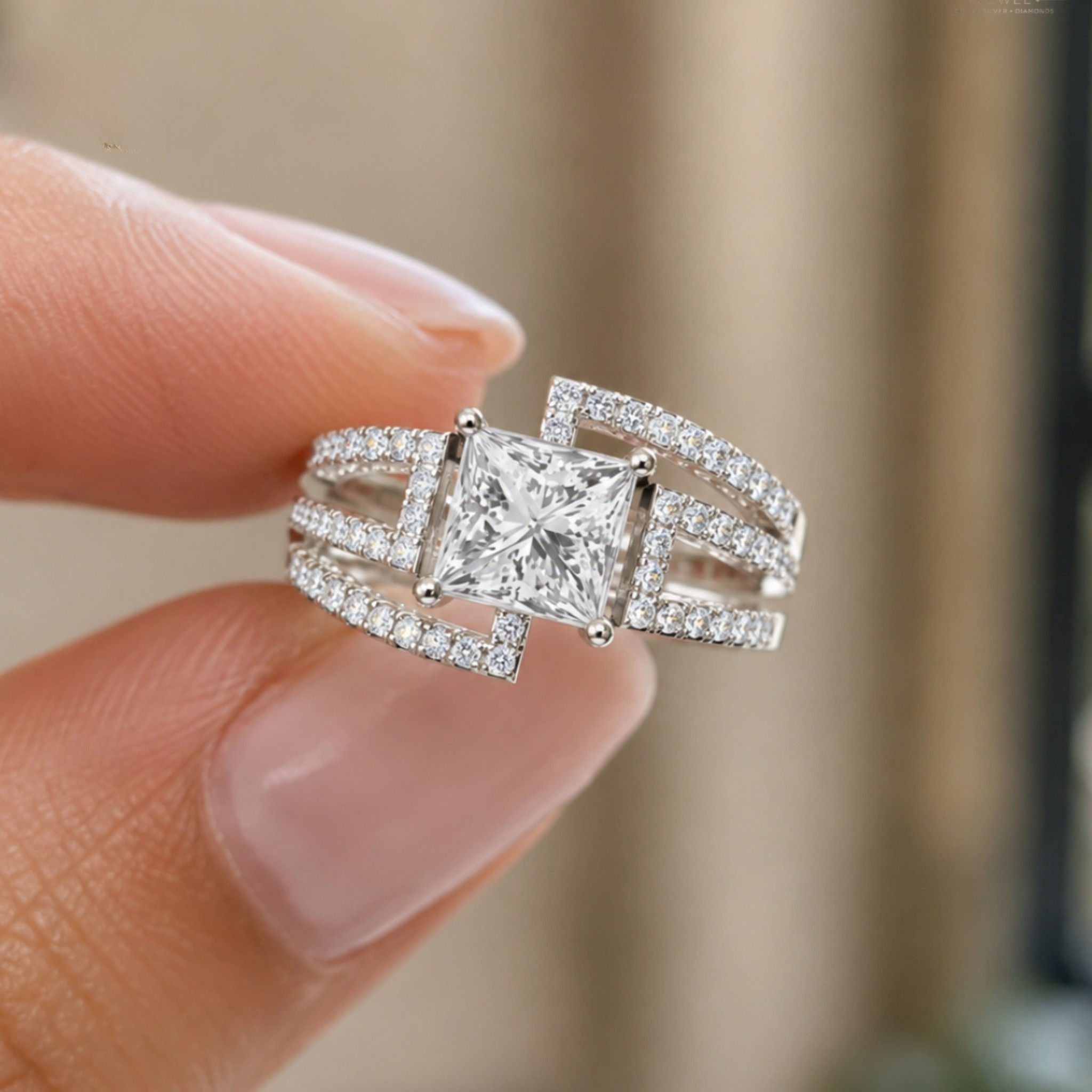 A silver-toned ring with a princess-cut center stone and pavé-set bands, held between fingers against a softly blurred beige background.