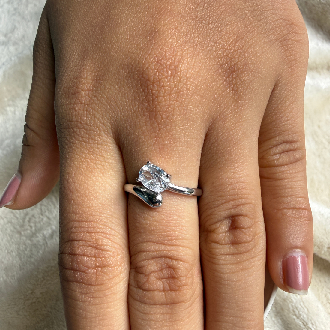 Oval lab-grown diamond bypass solitaire ring in white gold by Kiashaa Jewellery.