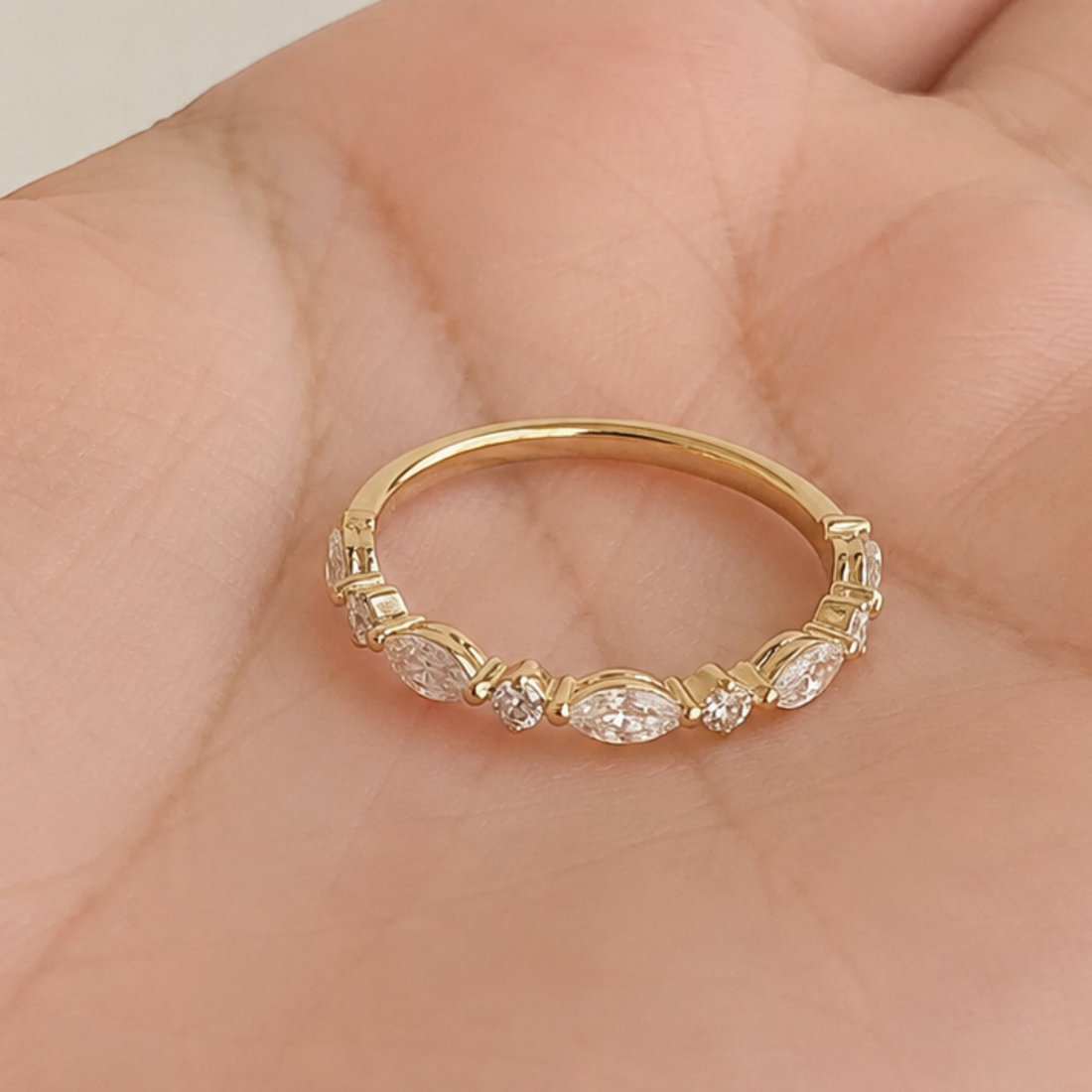 Marquise and round diamond wedding band by Kiashaa Jewellery in polished yellow gold.