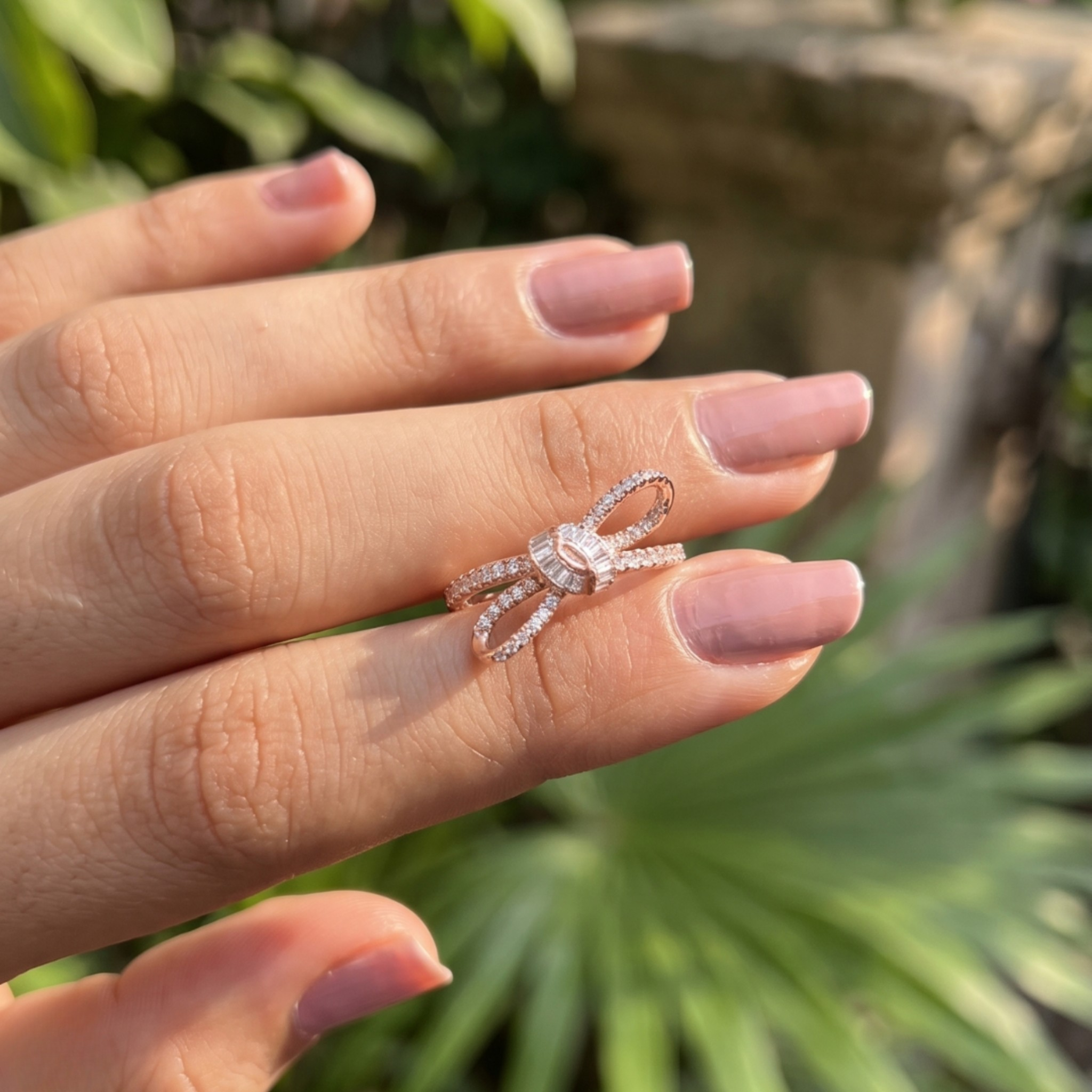 Luxury bow-inspired diamond ring handcrafted in 9K, 14K and 18K gold.