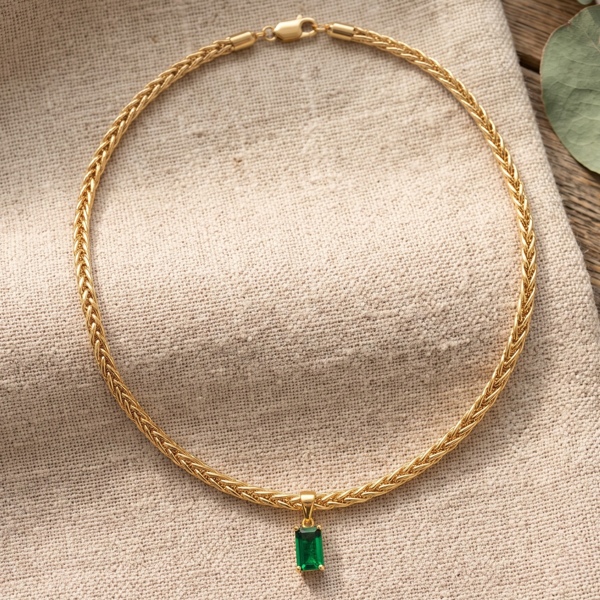 1.98 CT green emerald-cut pendant necklace in polished yellow gold.