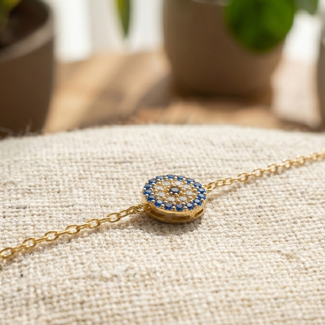 1.00 CT blue gemstone and diamond evil eye bracelet in yellow gold by Kiashaa Jewellery.