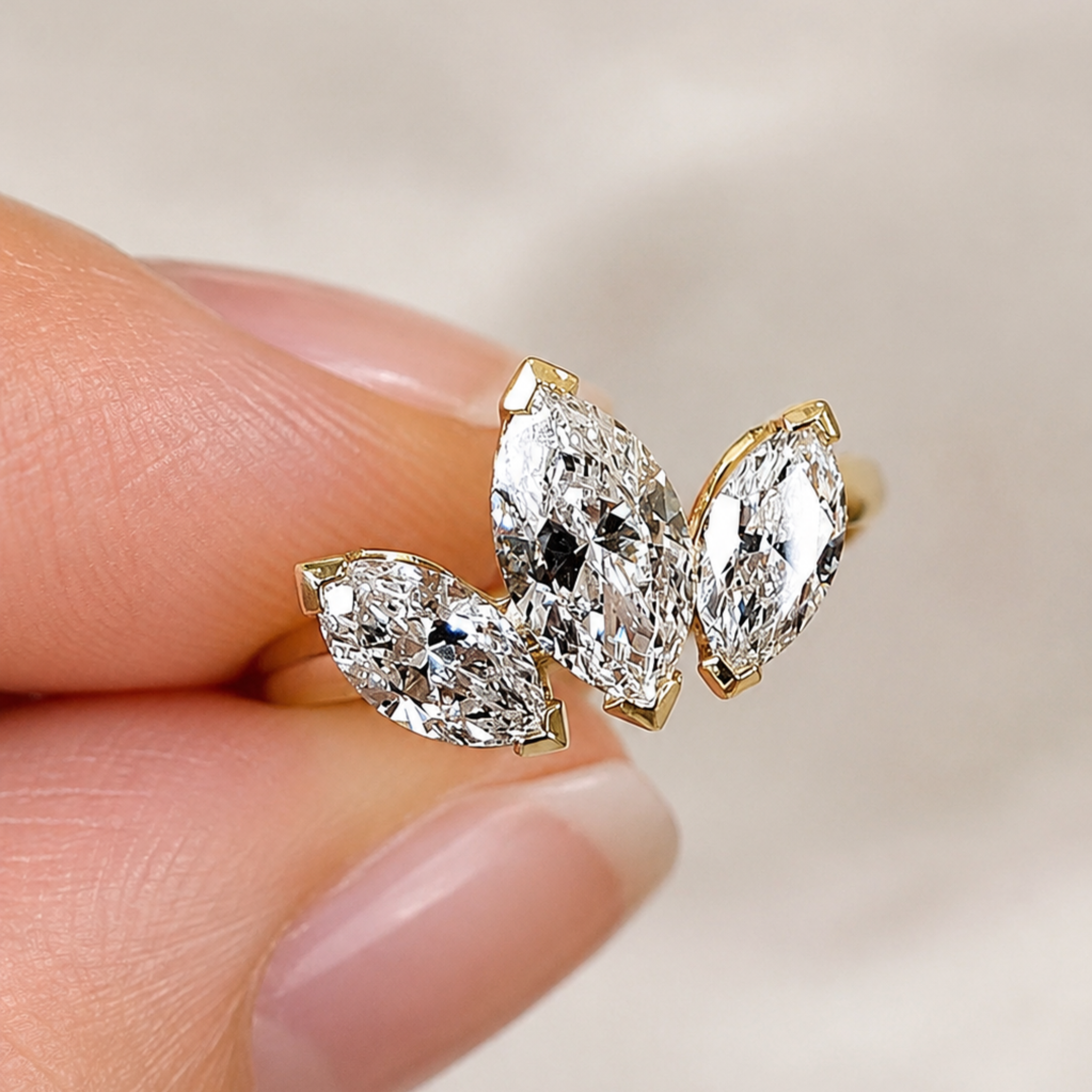 Yellow gold marquise diamond statement ring with an open sculptural design.