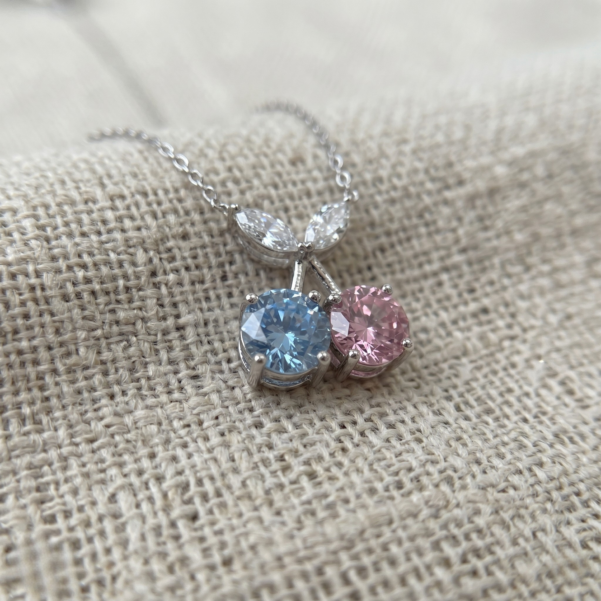 Blue and pink gemstone cherry pendant necklace with marquise lab-grown diamonds by Kiashaa Jewellery.