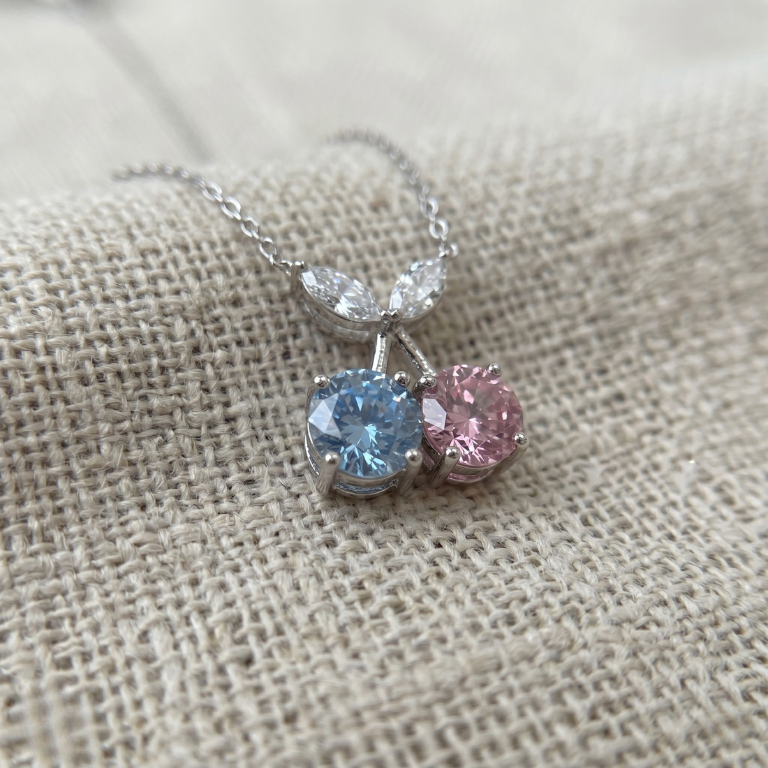 Blue and pink gemstone cherry pendant necklace with marquise lab-grown diamonds by Kiashaa Jewellery.