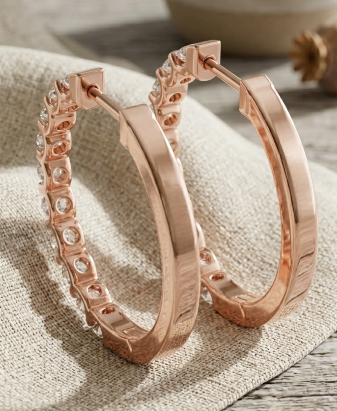 Front and back view of geometric diamond hoops showing open-backed settings and hinged post closures.