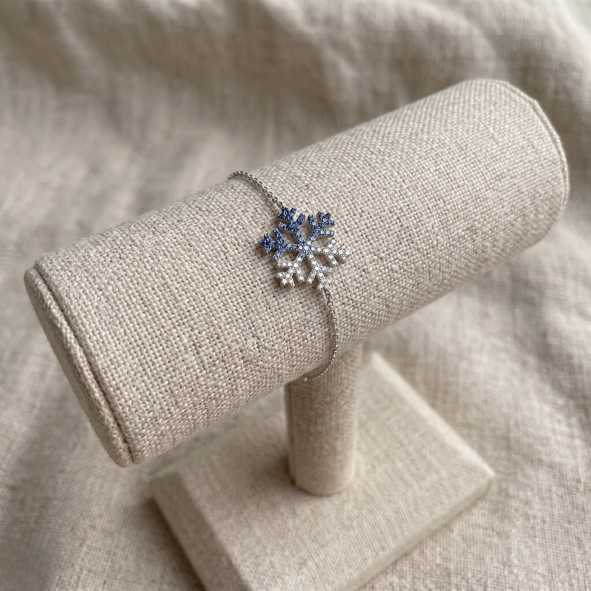 Blue gemstone and lab-grown diamond snowflake bracelet by Kiashaa Jewellery.