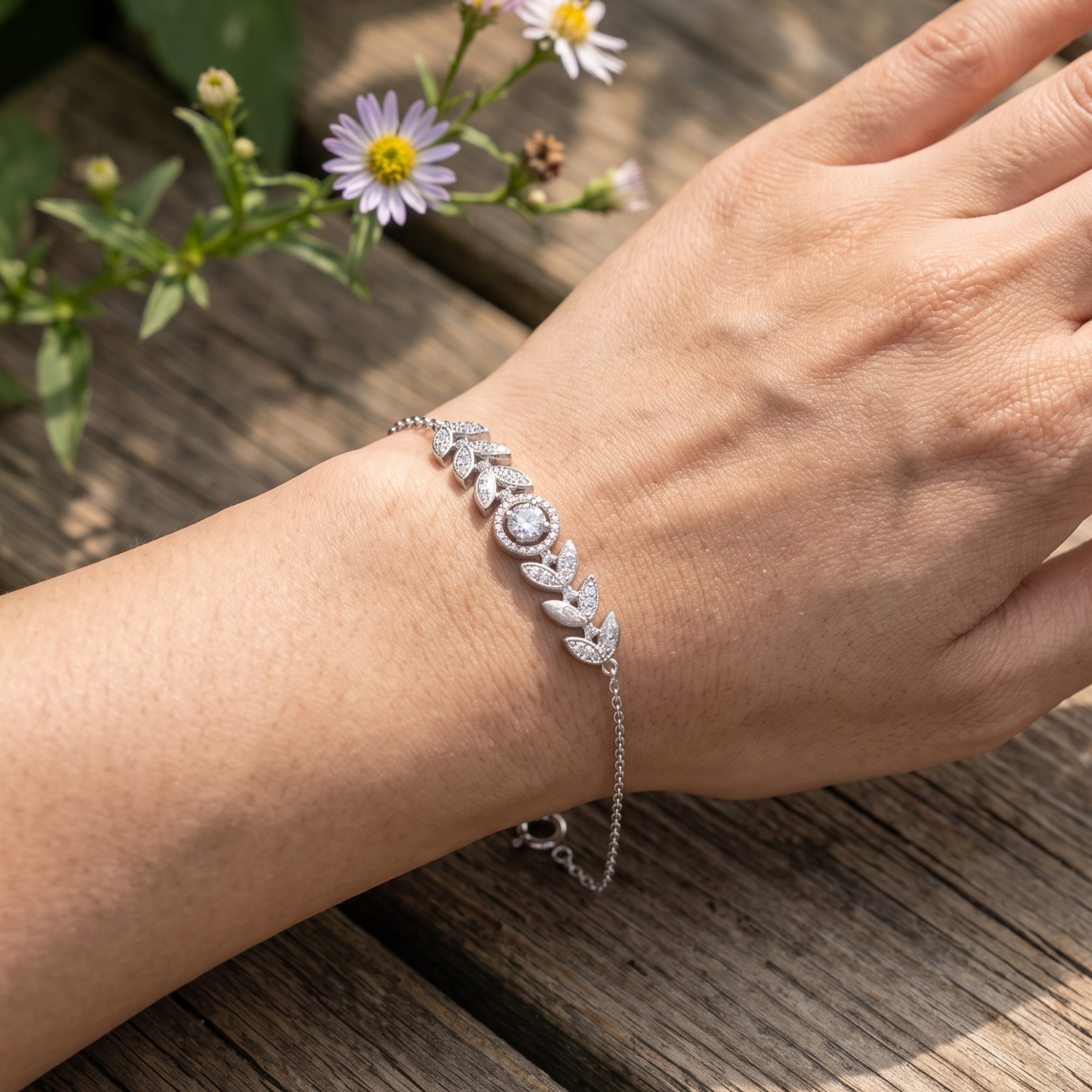 Botanical diamond bracelet featuring a 5.10 mm round center stone with leaf motifs.