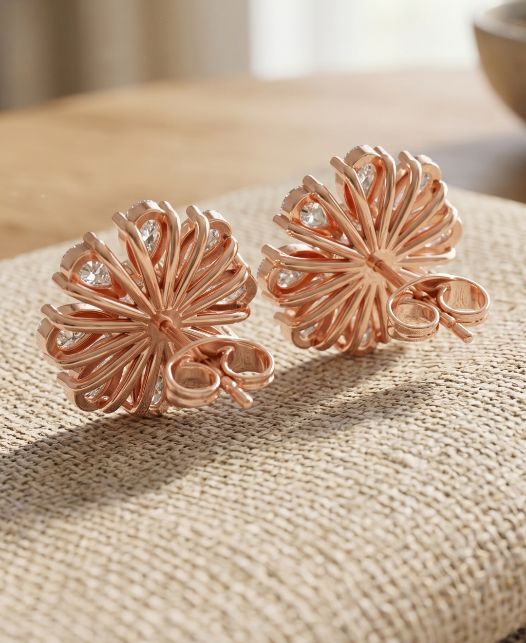 Front view of 4.120 CTW floral diamond earrings with cushion centres and symmetrical pear-shaped diamond petals.