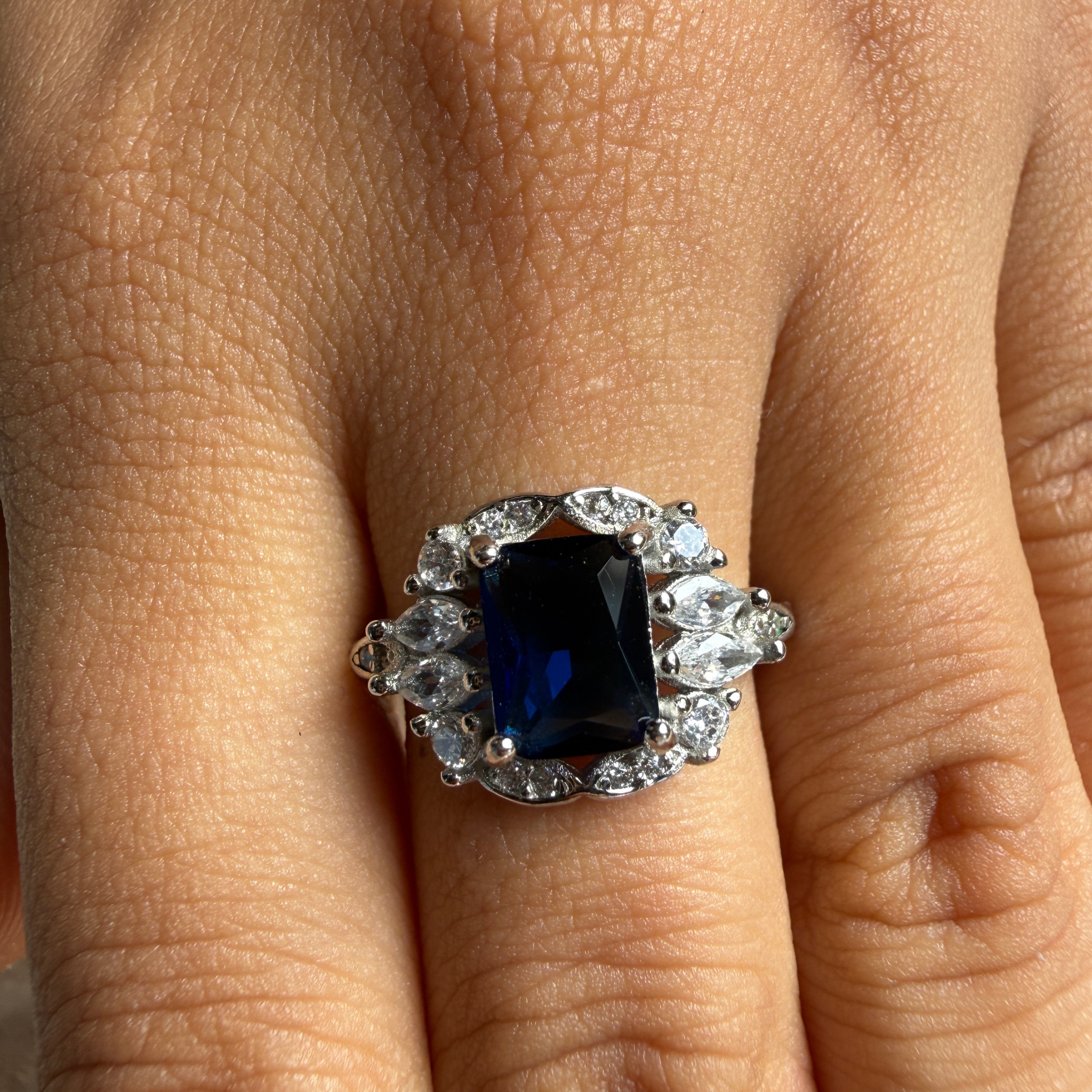 Blue emerald gemstone and lab-grown diamond halo ring by Kiashaa Jewellery.