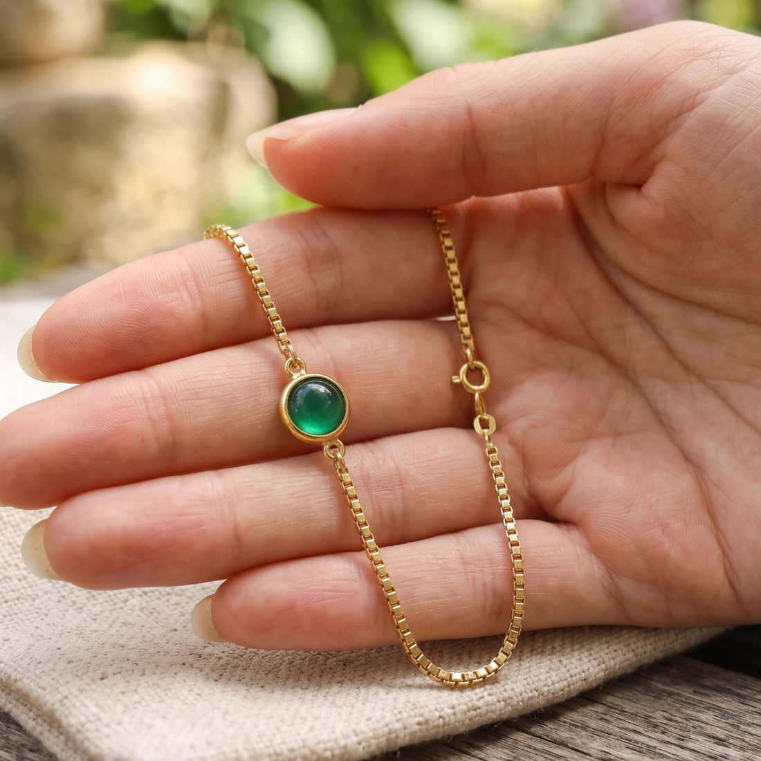 Kiashaa Jewellery 0.50 CT green oval gemstone bracelet in polished yellow gold.