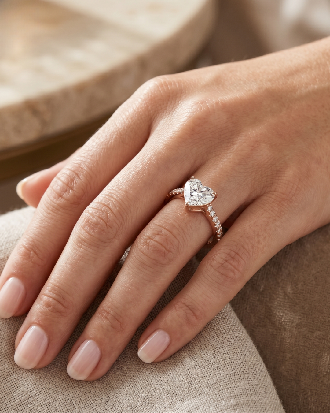 Close-up of a heart lab-grown diamond ring by Kiashaa Jewellery with a polished rose gold accent band