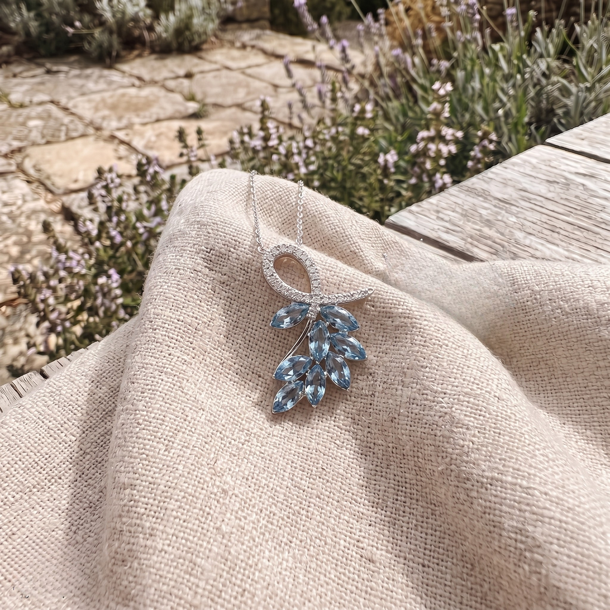 Sky blue marquise gemstone leaf pendant necklace with lab-grown diamonds by Kiashaa Jewellery.