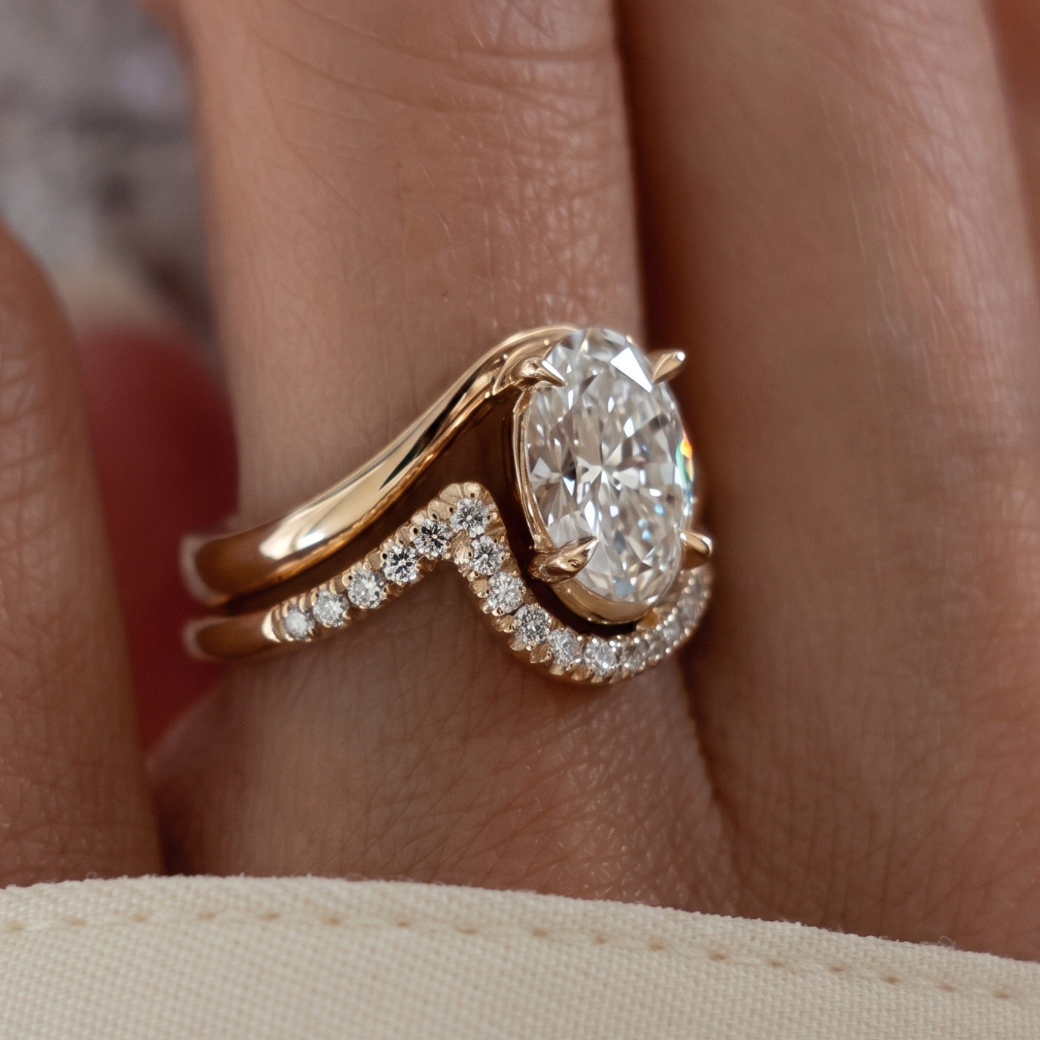 Oval diamond solitaire with matching curved round diamond wedding band