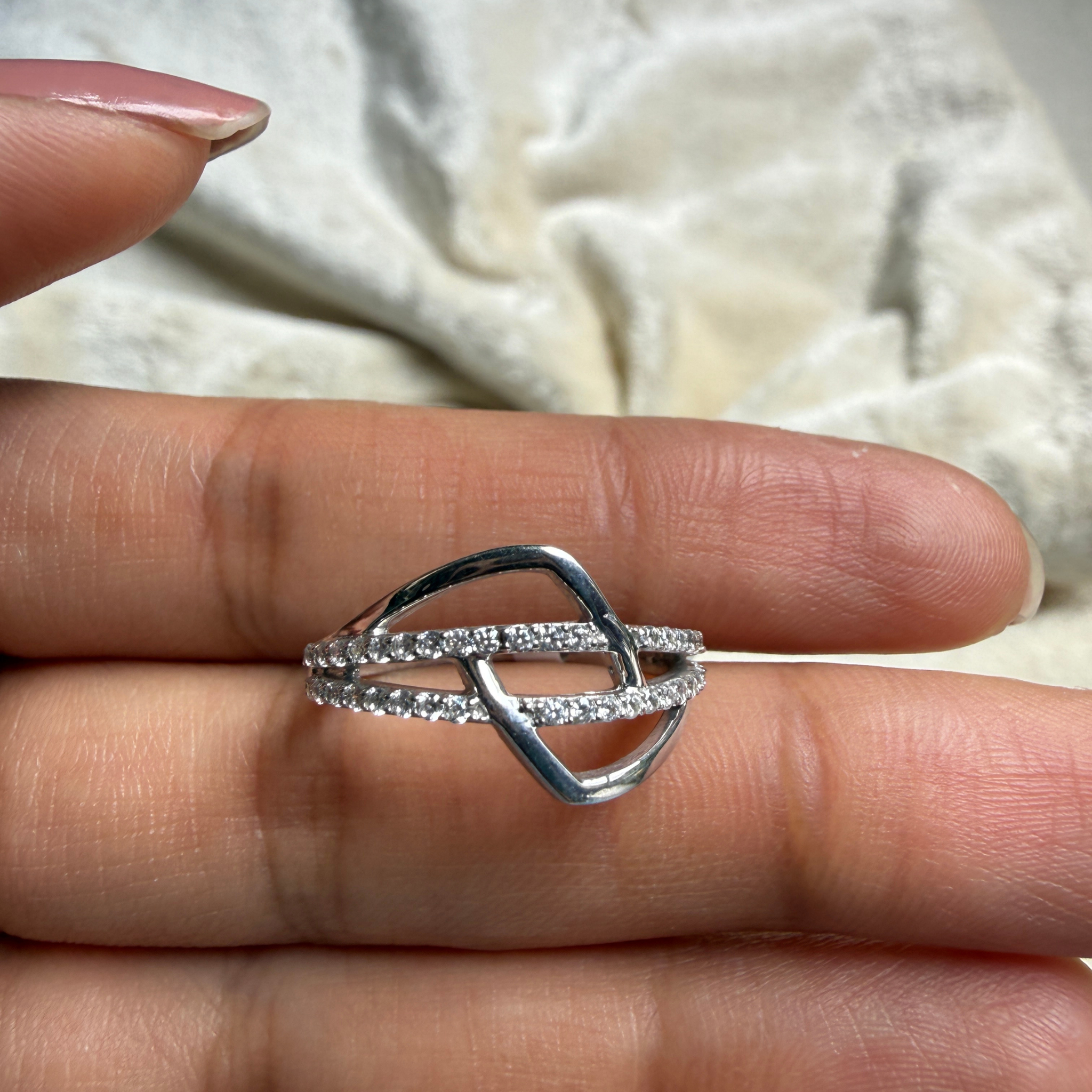 Contemporary open-frame diamond ring handcrafted in 9K, 14K and 18K gold.