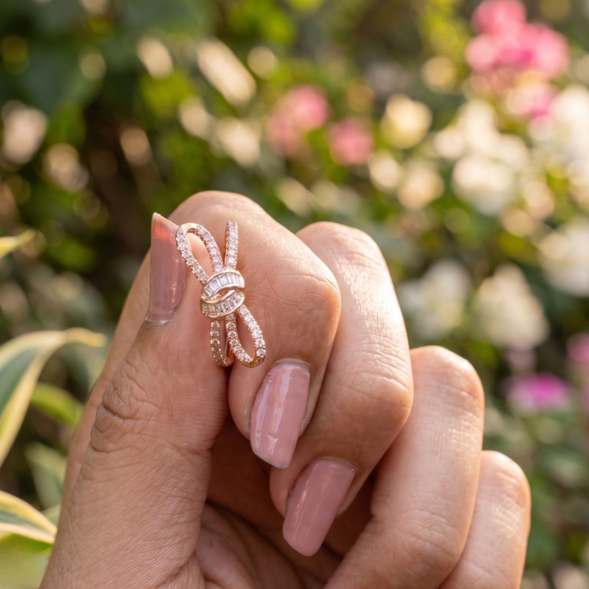 Luxury bow-inspired diamond ring handcrafted in 9K, 14K and 18K gold.