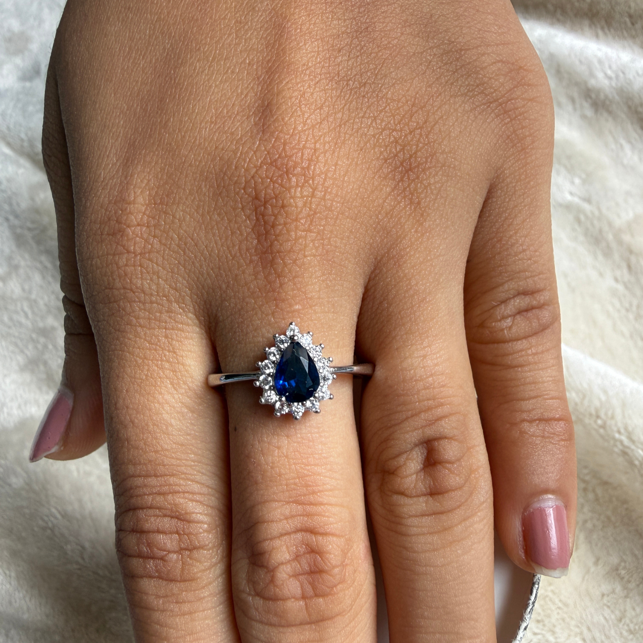 Blue pear gemstone and lab-grown diamond halo ring by Kiashaa Jewellery.