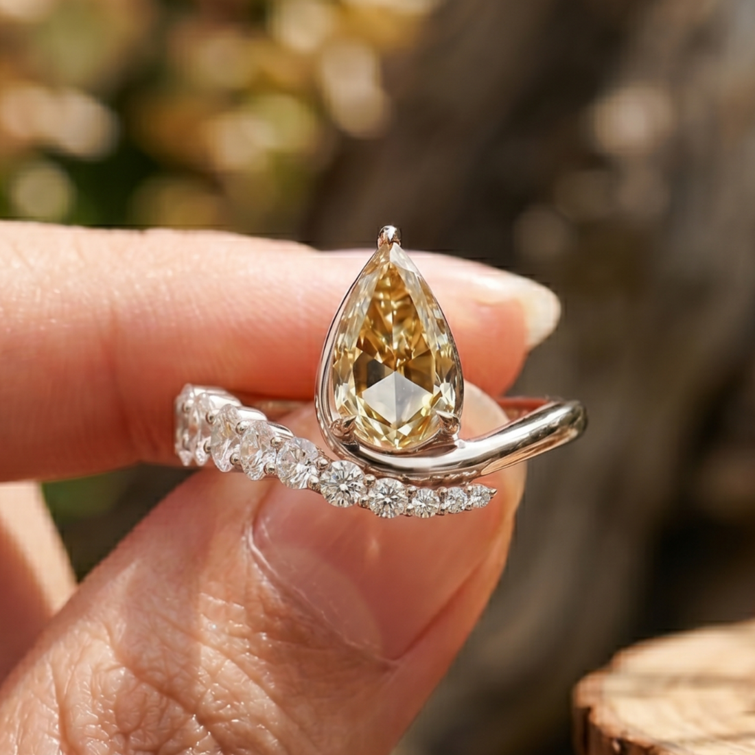 Aurelia 4.50 CTW pear diamond bypass ring by Kiashaa Jewellery featuring a 3 CT pear center diamond in polished yellow gold.