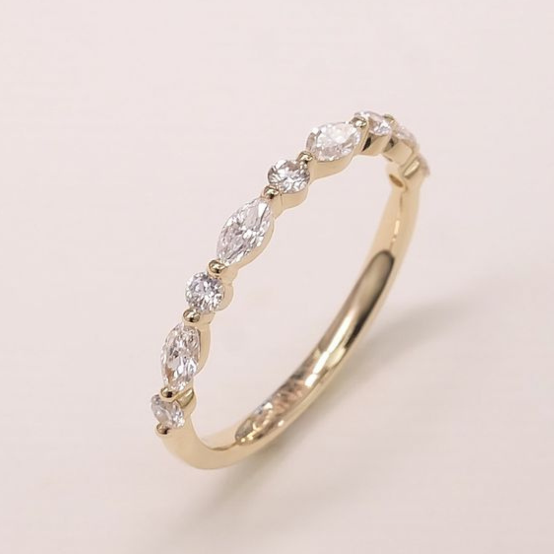 Marquise and round diamond wedding band by Kiashaa Jewellery in polished yellow gold.