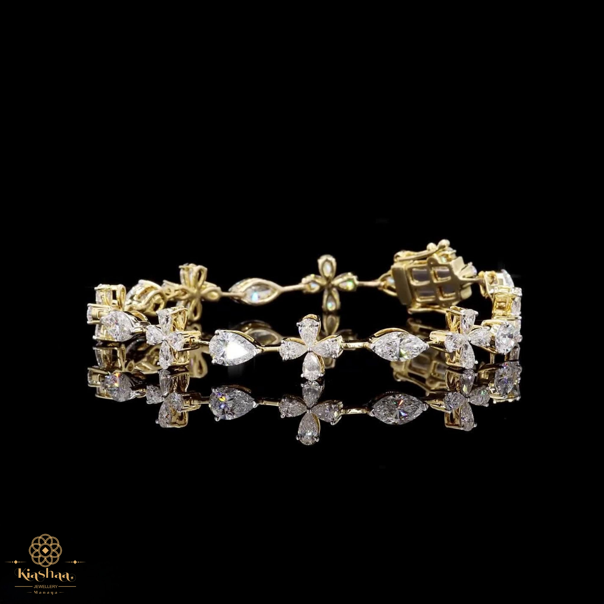A yellow gold bracelet adorned with multiple clear gemstones, including marquise-cut, round-cut, and baguette shapes, displayed on a reflective black surface against a solid black background.
