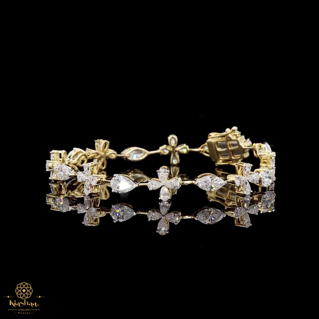 A yellow gold bracelet adorned with multiple clear gemstones, including marquise-cut, round-cut, and baguette shapes, displayed on a reflective black surface against a solid black background.