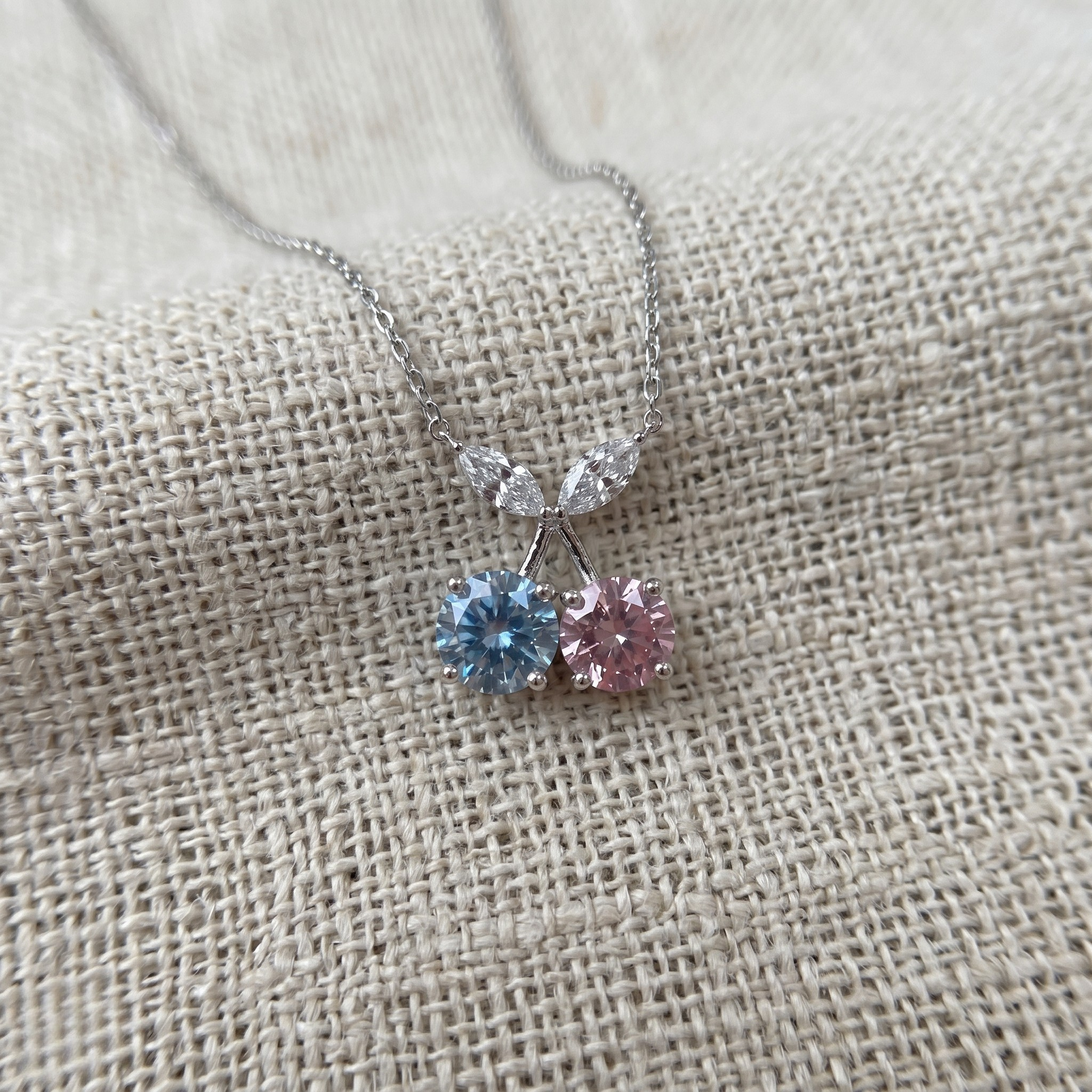 Blue and pink gemstone cherry pendant necklace with marquise lab-grown diamonds by Kiashaa Jewellery.