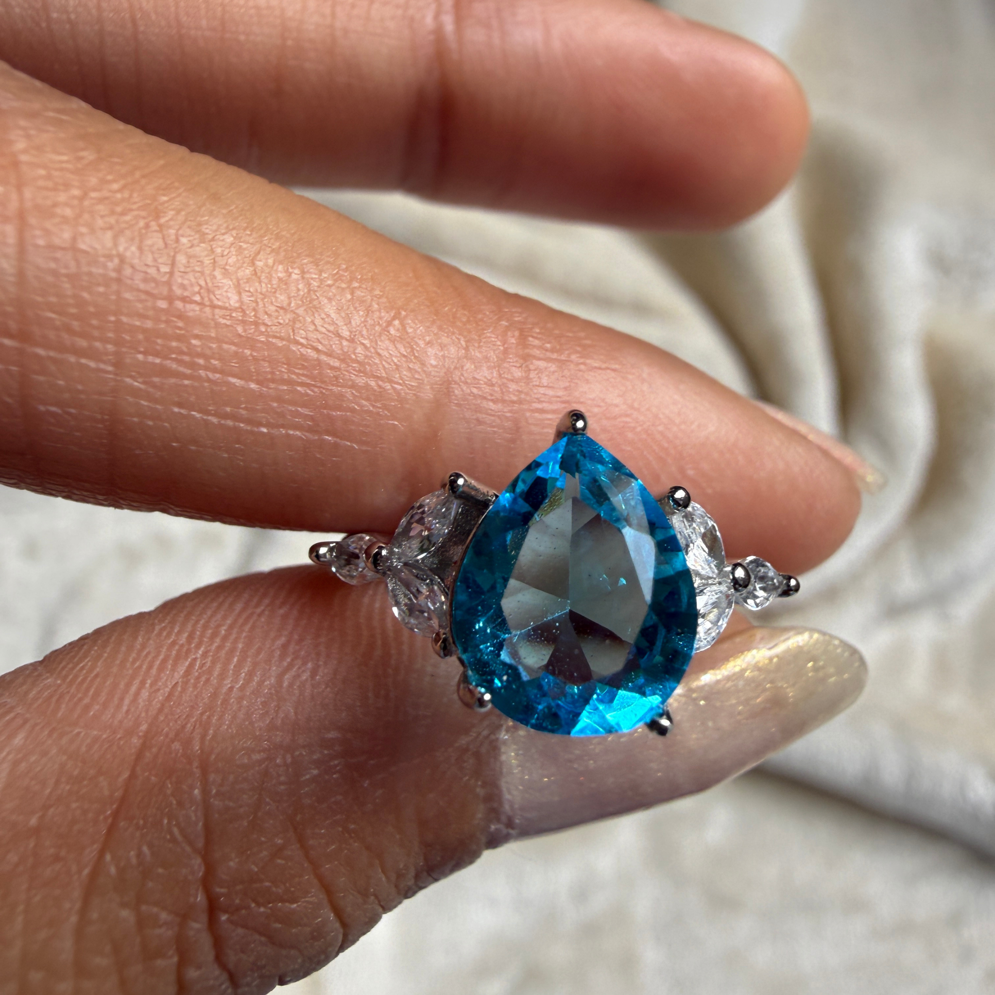 Blue pear gemstone and marquise lab-grown diamond ring by Kiashaa Jewellery.