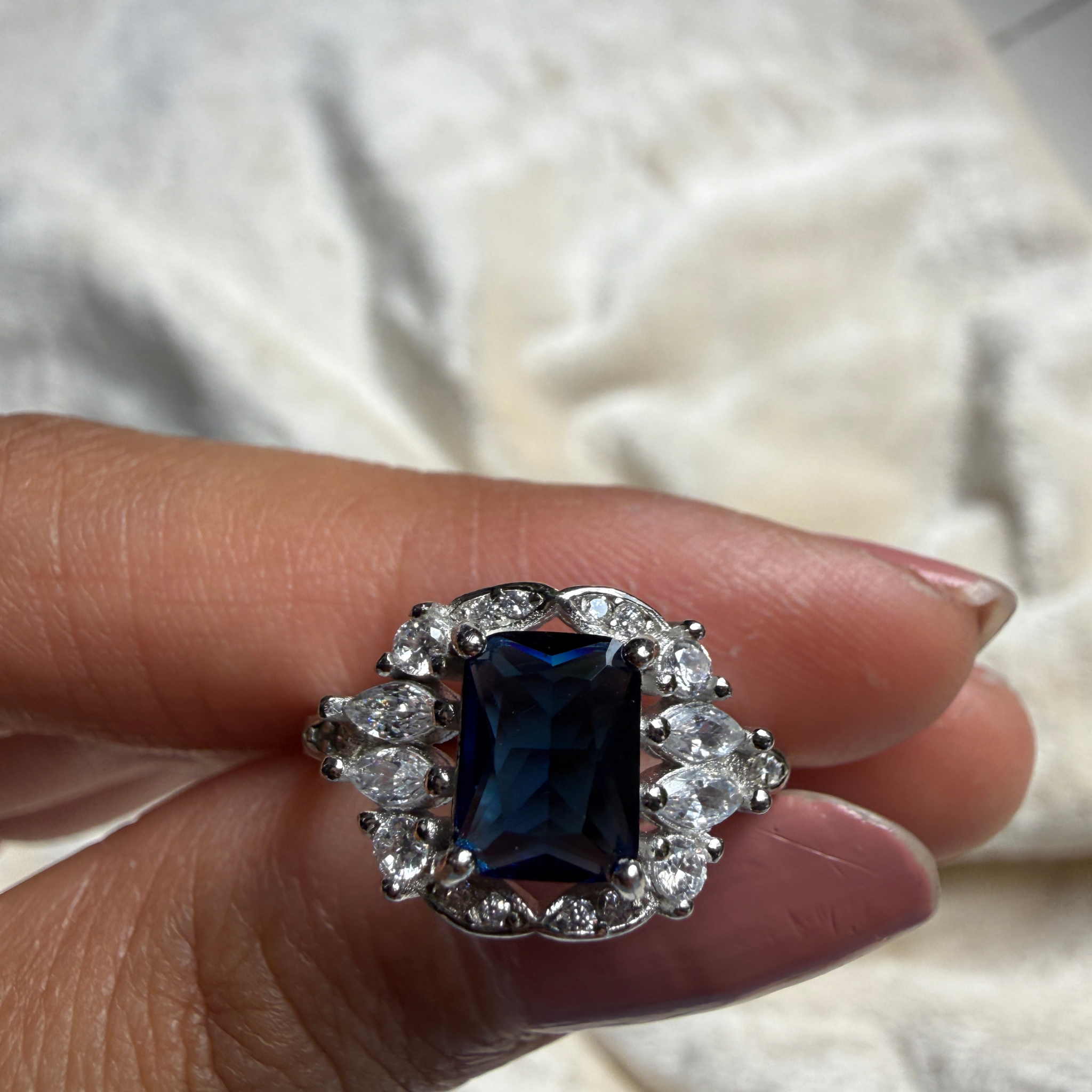 Blue emerald gemstone and lab-grown diamond halo ring by Kiashaa Jewellery.