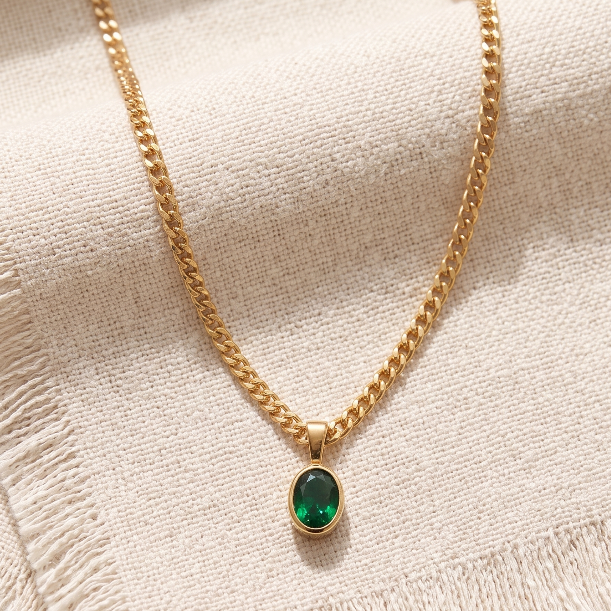 1.98 CT green oval gemstone pendant necklace with polished yellow gold Cuban chain.