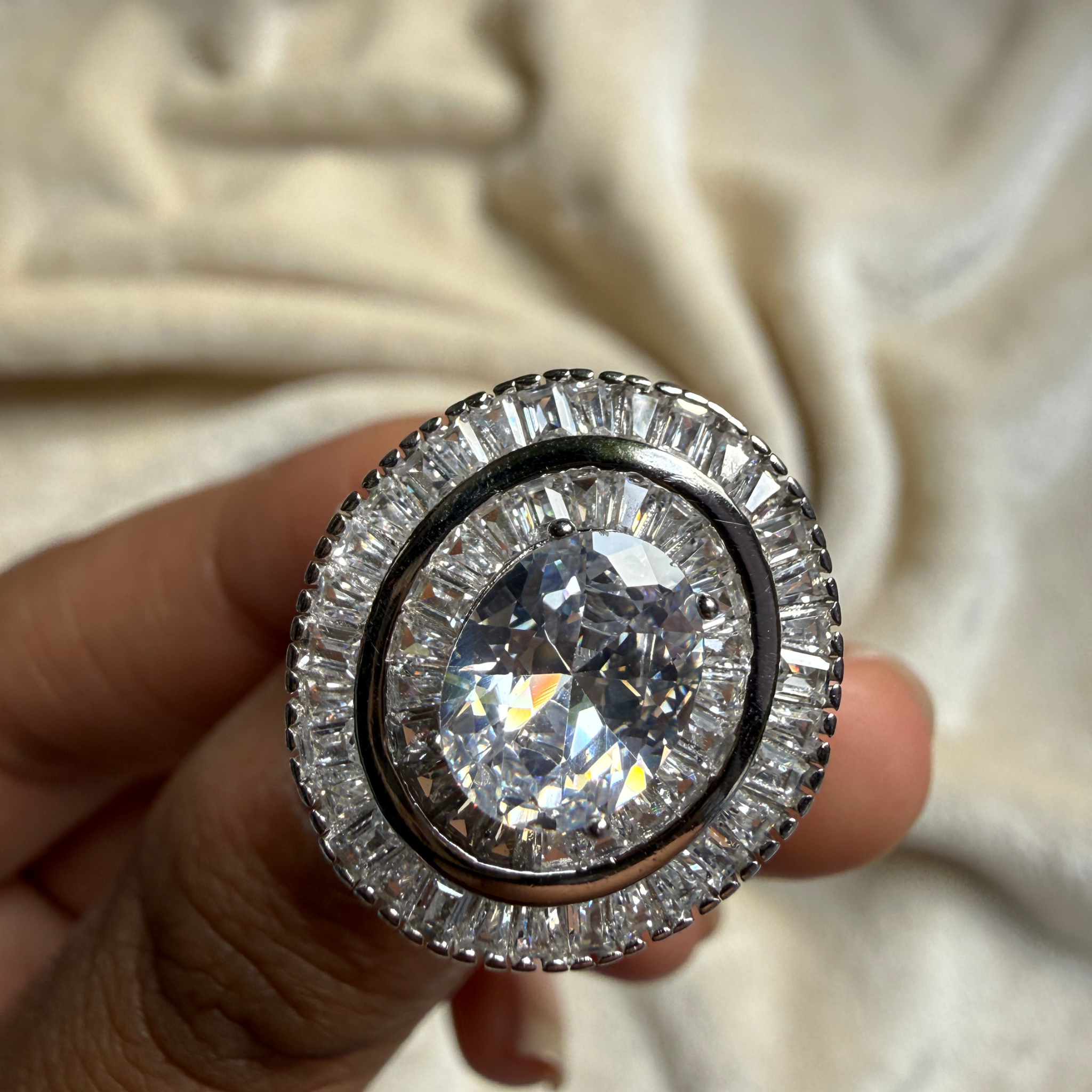 Oval and baguette lab-grown diamond double halo ring by Kiashaa Jewellery.
