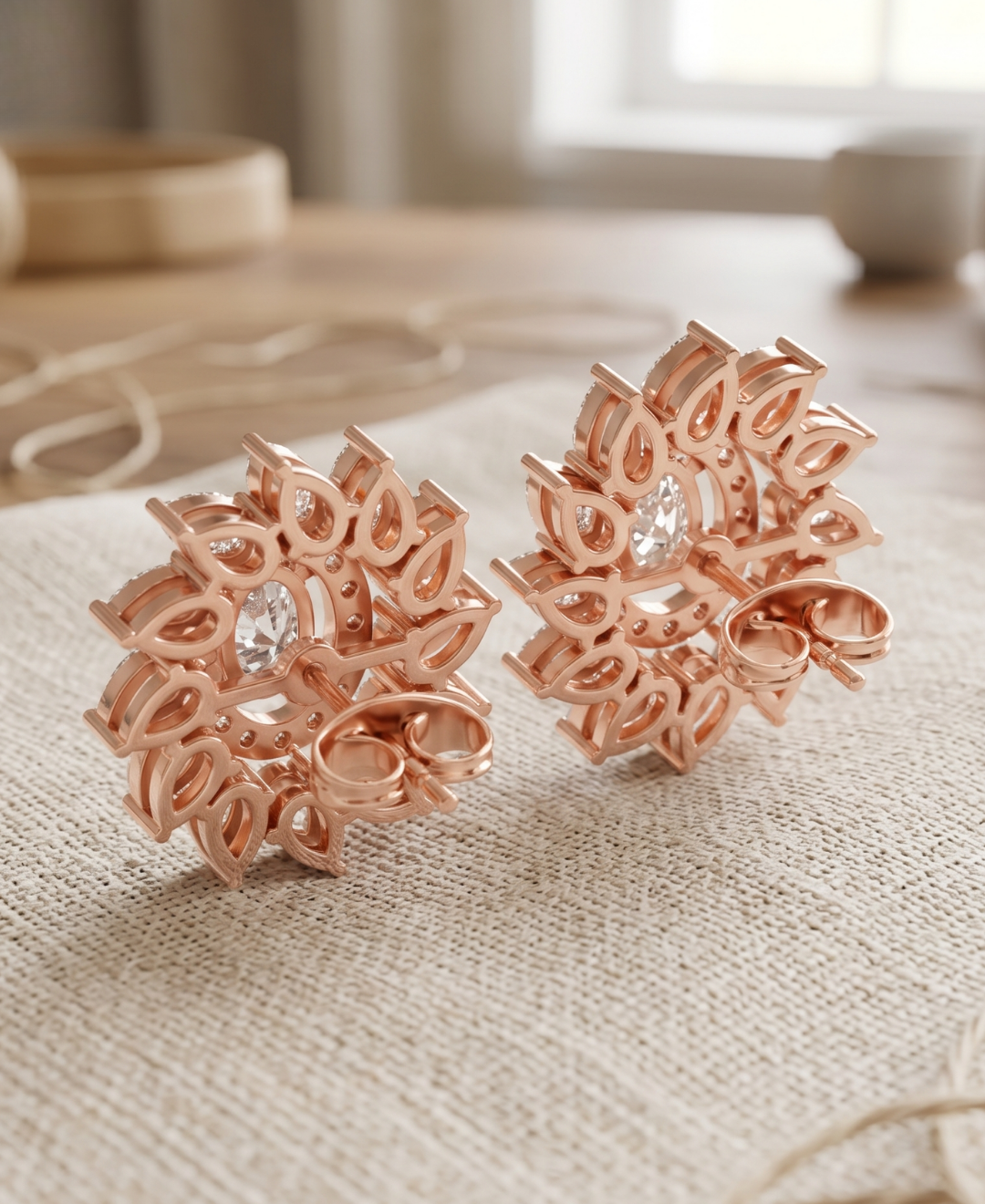 Close-up of oval lab-grown diamond centres surrounded by round halos and pear-cut diamond petals.
