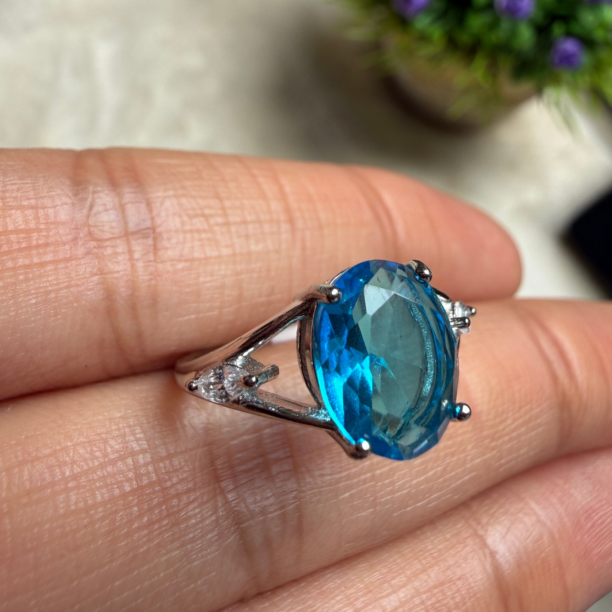 Blue oval gemstone solitaire ring with marquise lab-grown diamonds by Kiashaa Jewellery.