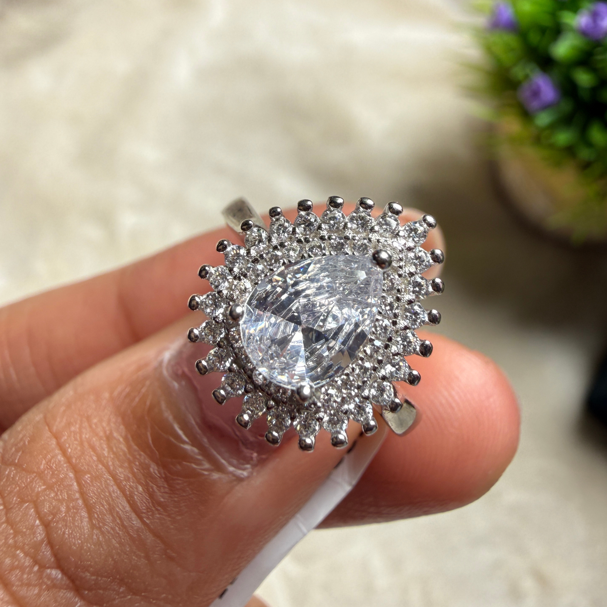 Pear halo lab-grown diamond engagement ring in white gold by Kiashaa Jewellery.