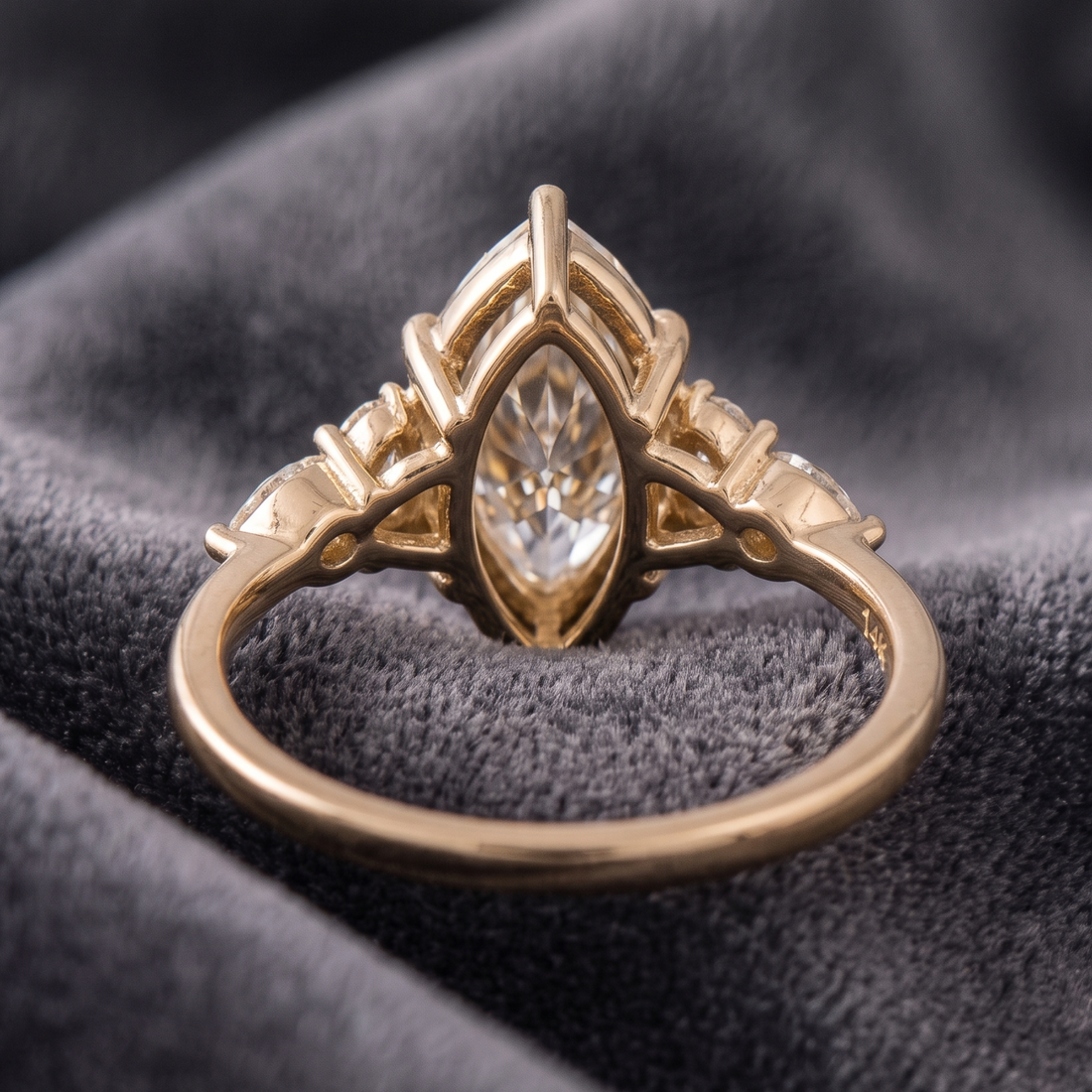 Yellow gold marquise diamond proposal ring with round brilliant accents