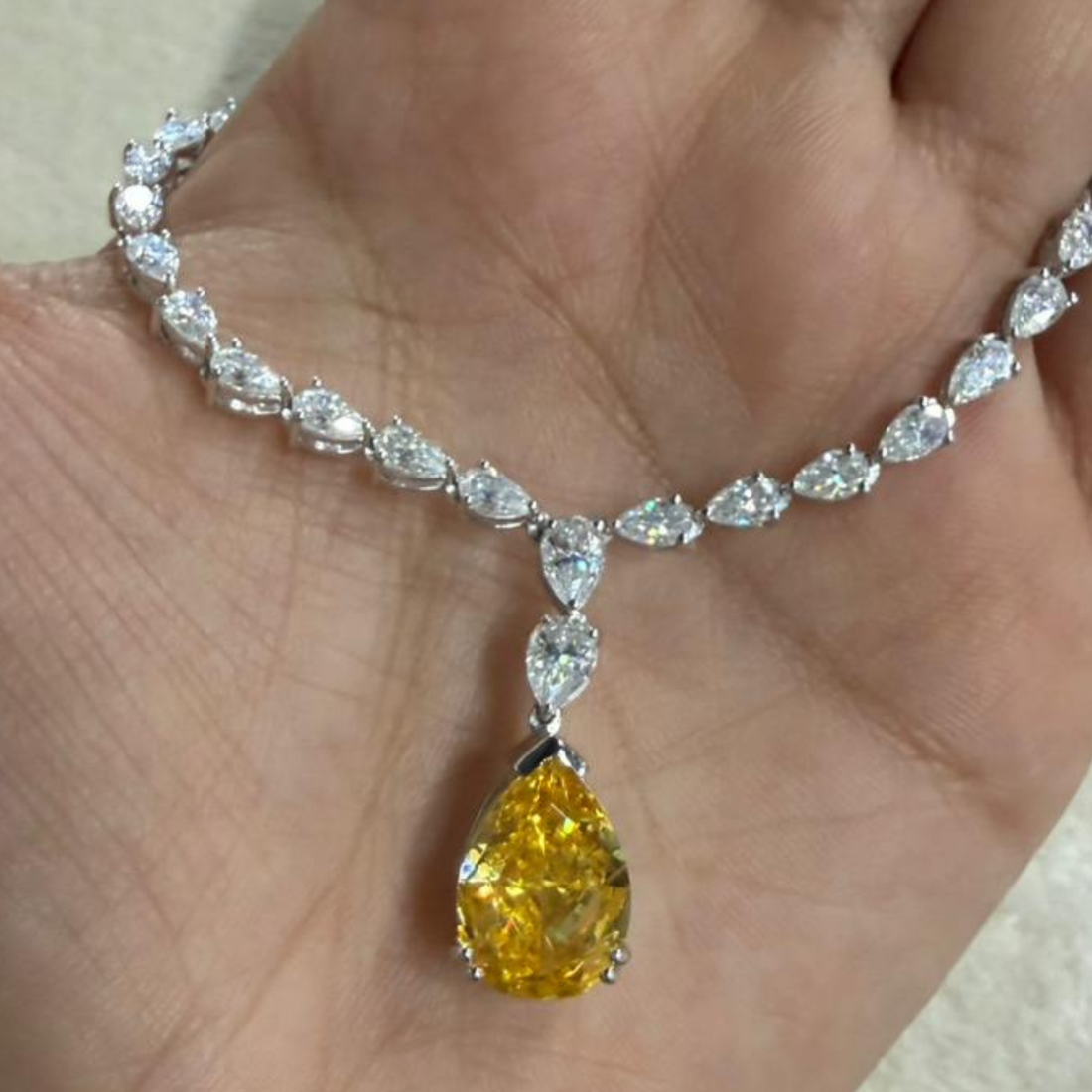 Luxury statement necklace featuring 74 listed pear-shaped stones in a graduated arrangement.