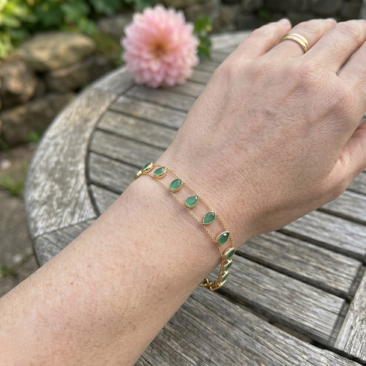 Elegant botanical bracelet with pear and marquise-shaped green crystal stations.