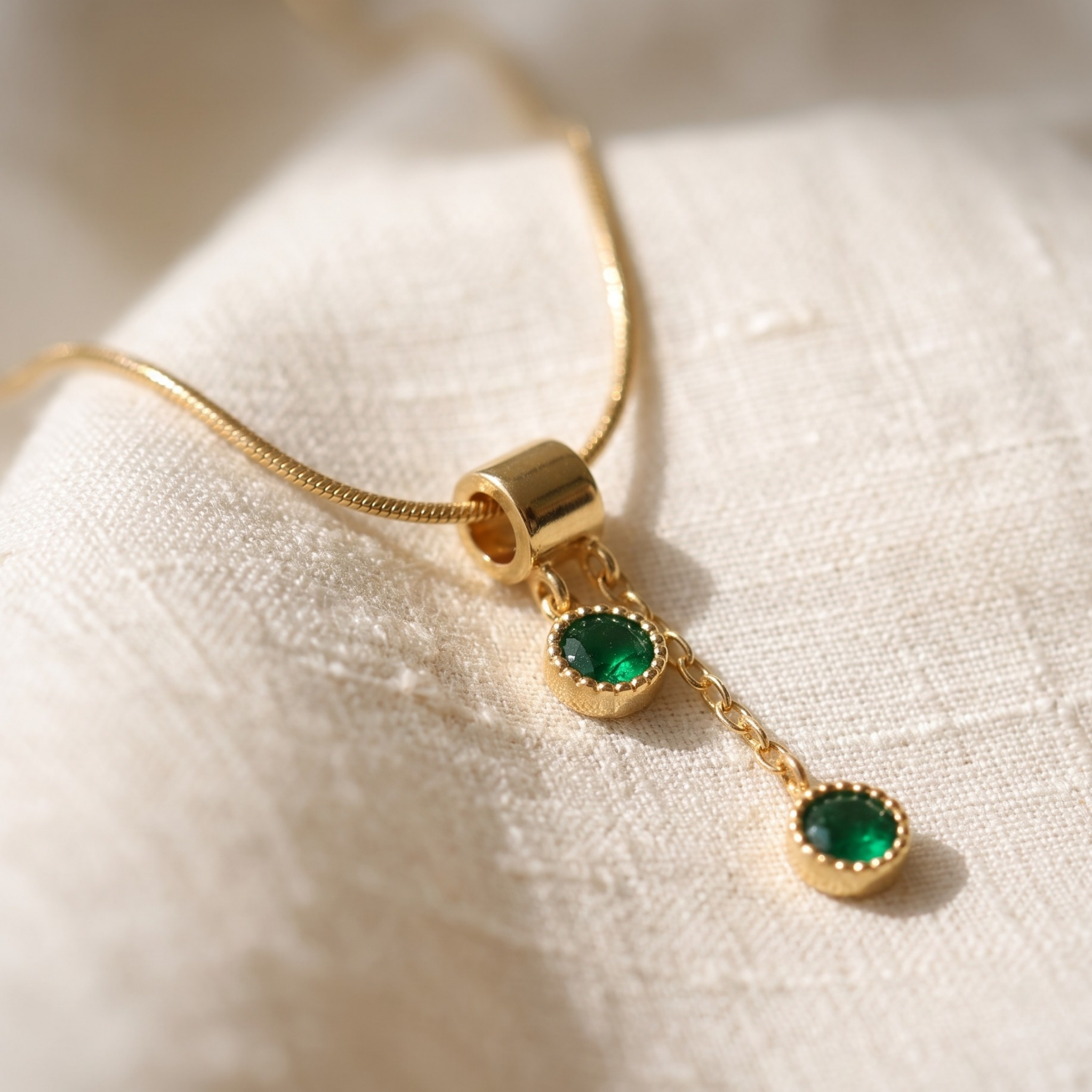  1.50 CTW green round gemstone drop necklace in polished yellow gold.
