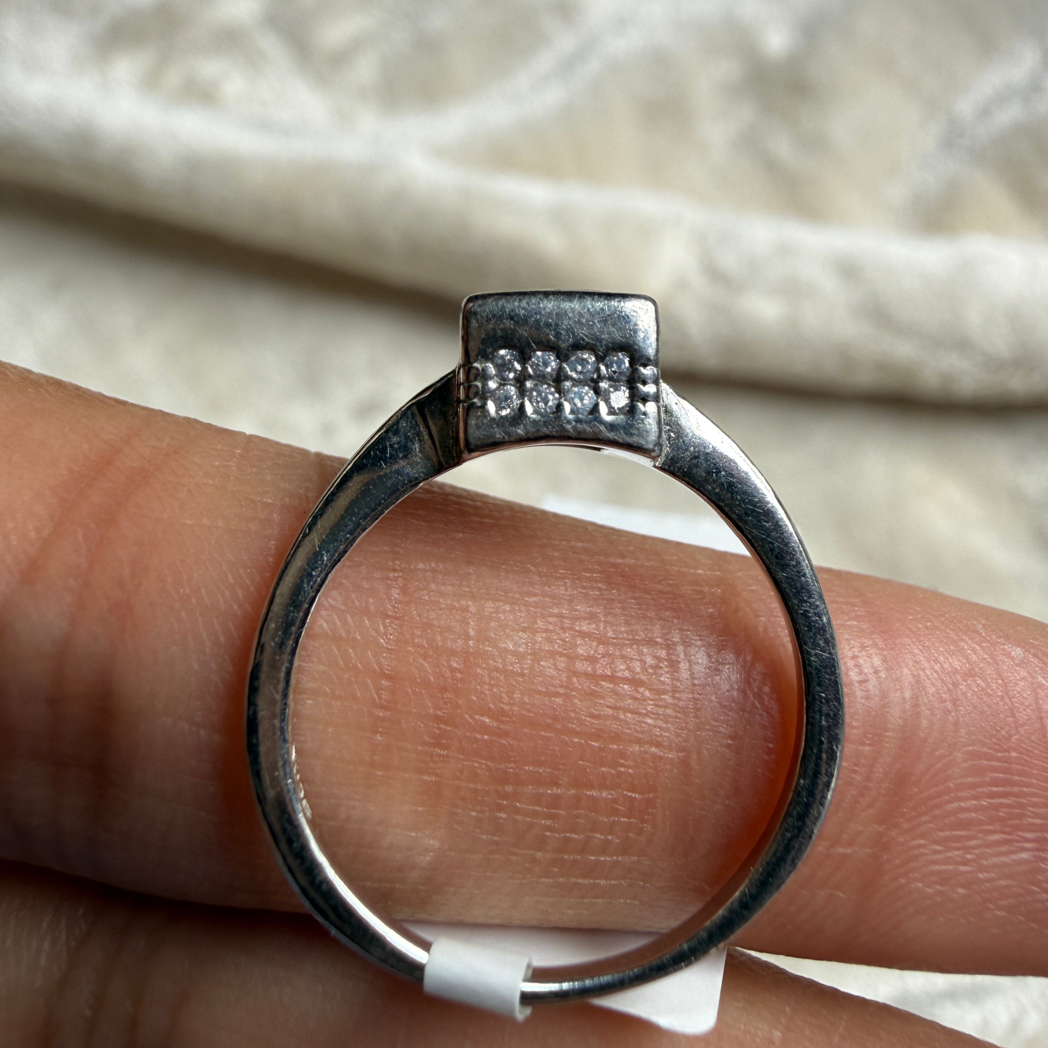 Red princess-cut gemstone solitaire ring in white gold by Kiashaa Jewellery.